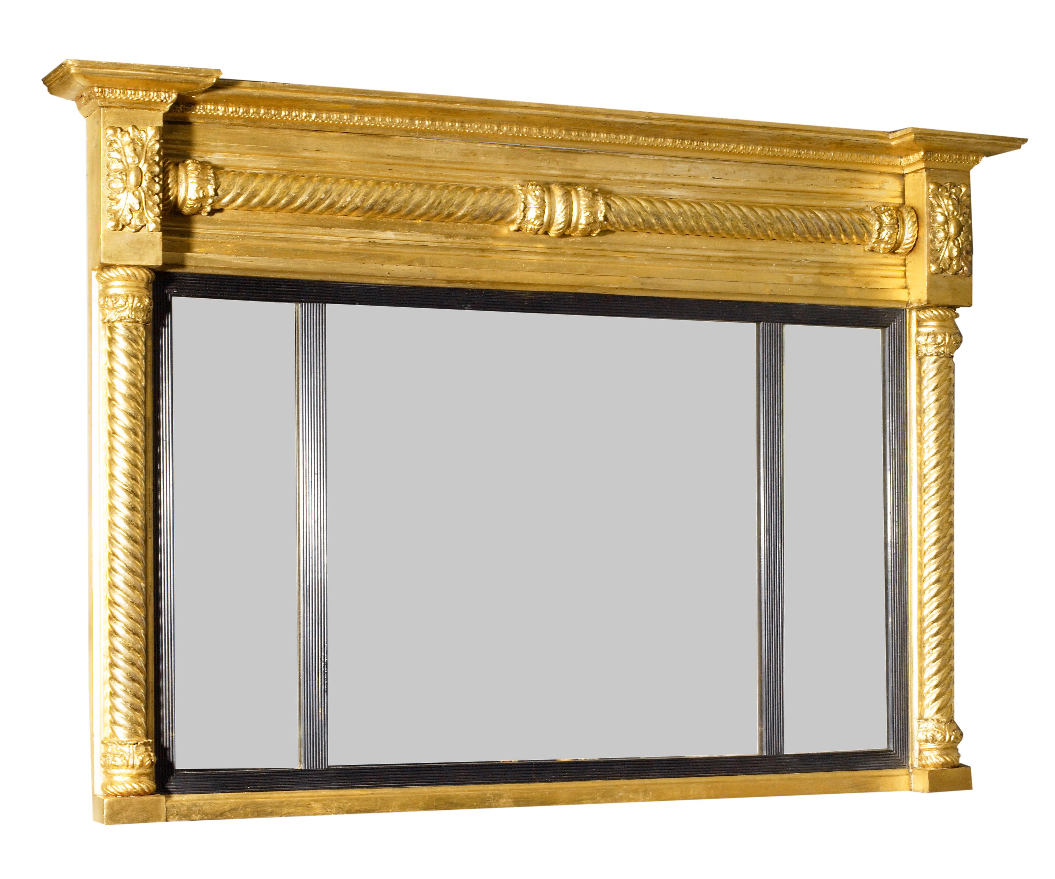 19th century three compartmental overmantle mirror. The mirror with three carved columns with detailed foliage design at the top edges.