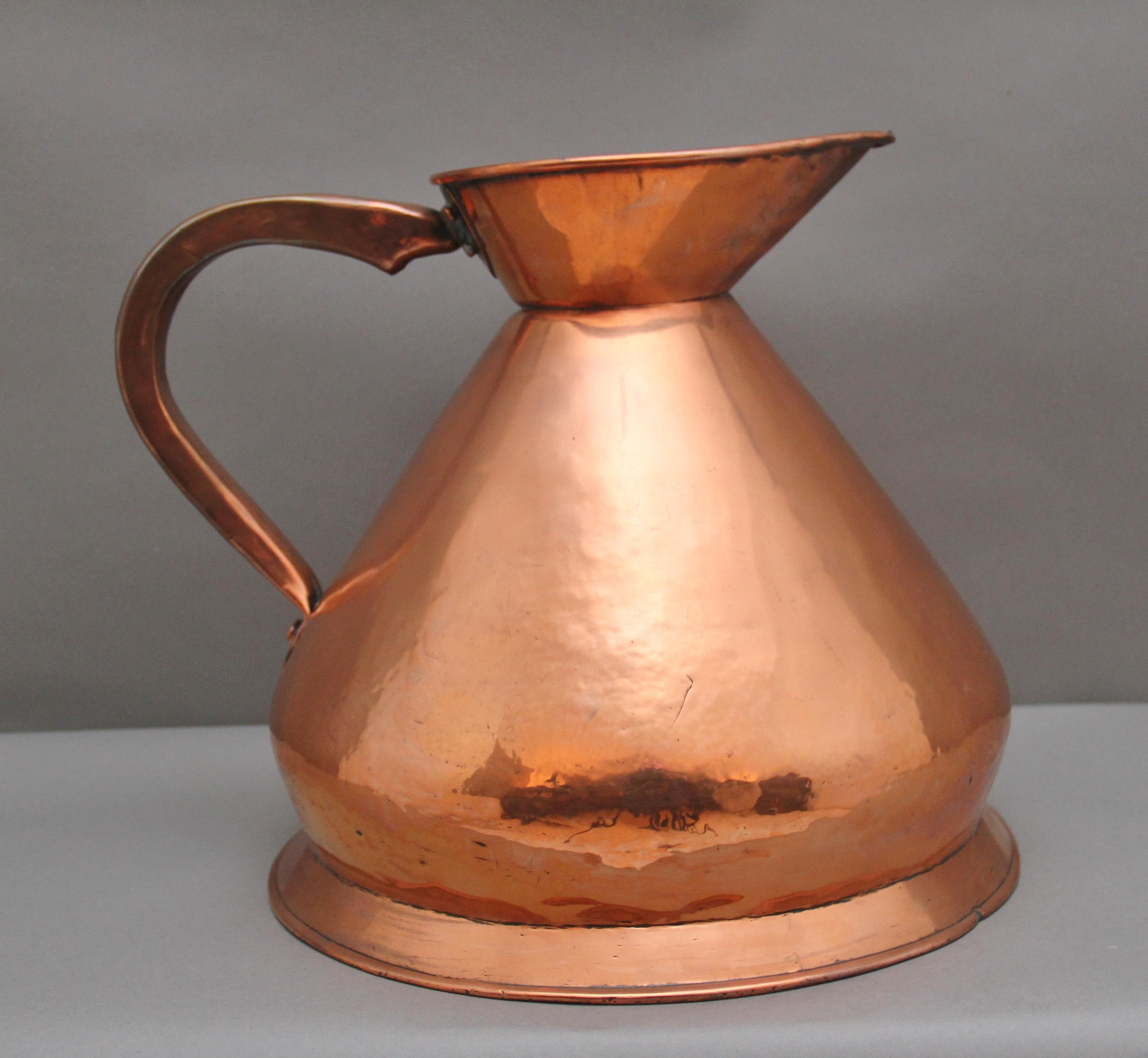 19th Century three gallon copper haystack measuring jug in very good condition and marked at the front with three gallon, having a large shaped handle to one side, the haystack jug named for it's wide based form and having a large spout.  Circa 1870.
