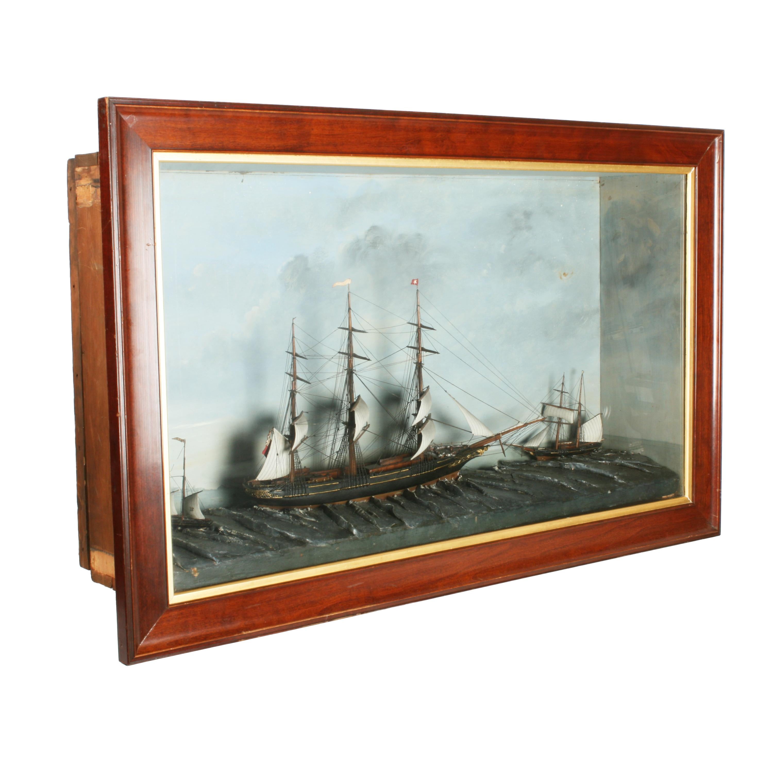 A 19th century Victorian diorama of three sailing ships at sea.

The main three mast sailing ship is the 'Snowflake' and the two smaller ships are for and aft.

The ships are at sea with a painted coastline and other ships in the