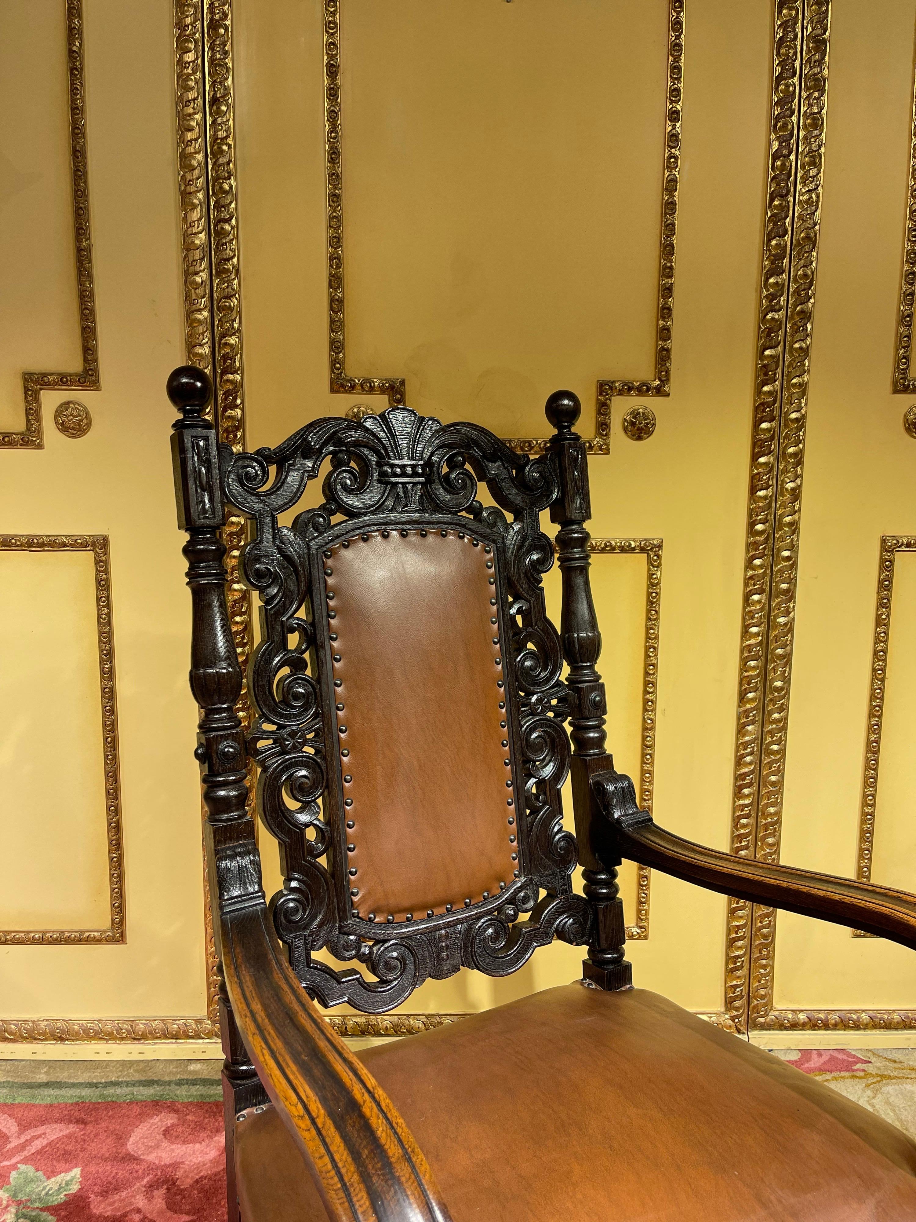 19th century throne chair, historicism around 1880, oak.

Stately throne made of solid oak, hand-carved and blackened. High quality carved. Seat upholstery covered with leather.
Germany around 1880, historicism.