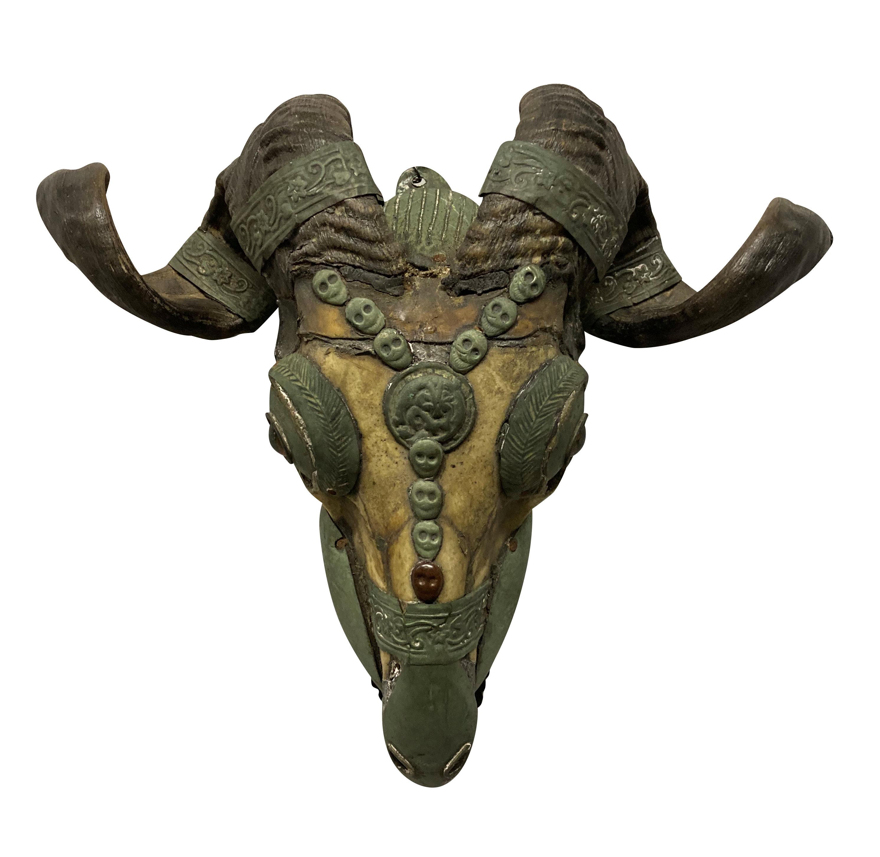 A XIX century Tibetan ceremonial Kapala Goat skull, decorated with silver and copper, articulated jaw, and life-like glass eyes. These items were used by Buddhist Tantra practising monks.