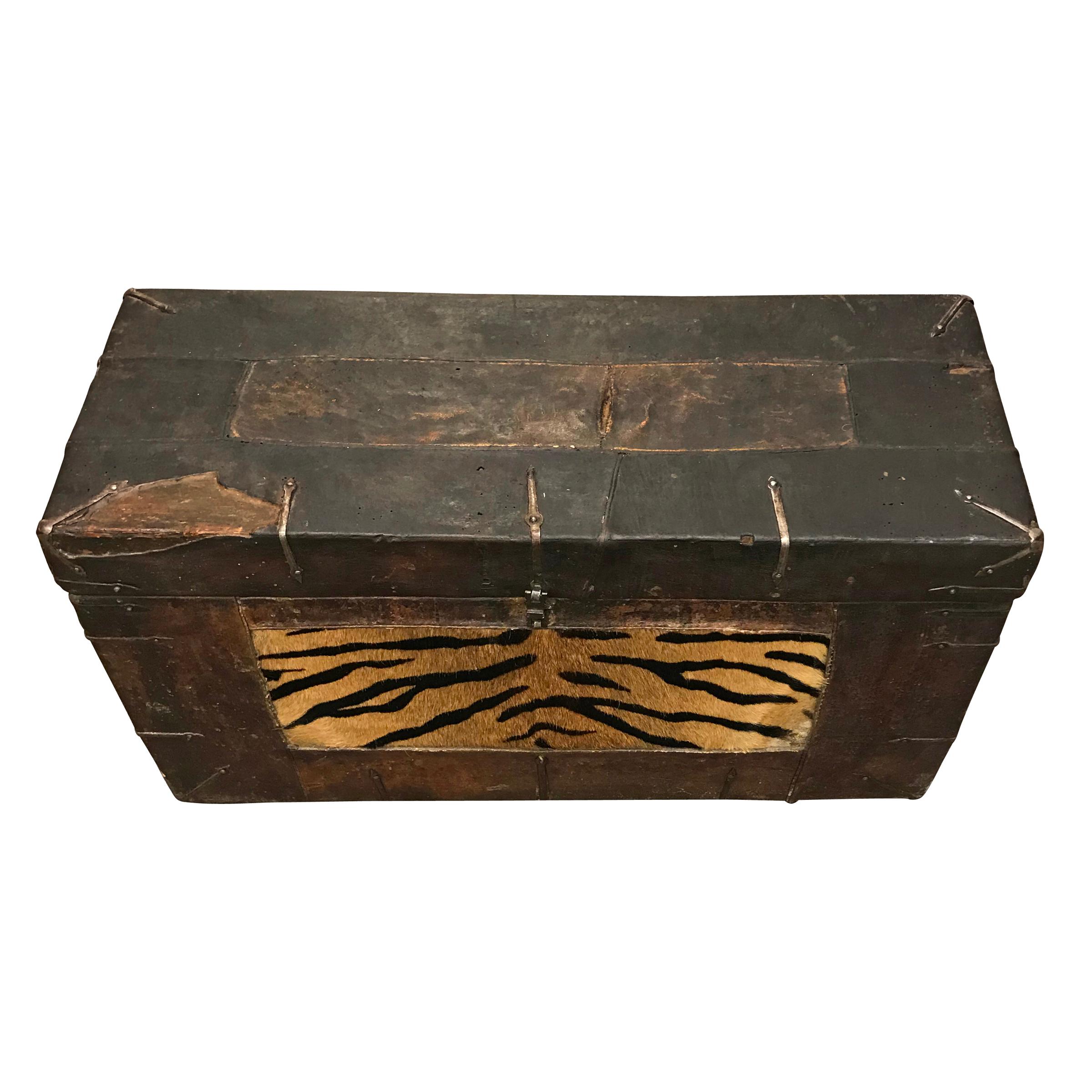 A gorgeous 19th century Tibetan wood trunk, covered in leather, with a cowhide panel painted to mimic tiger fur. In Tibet, tigers symbolize unconditional confidence, disciplined awareness, kindness and modesty; all good things!