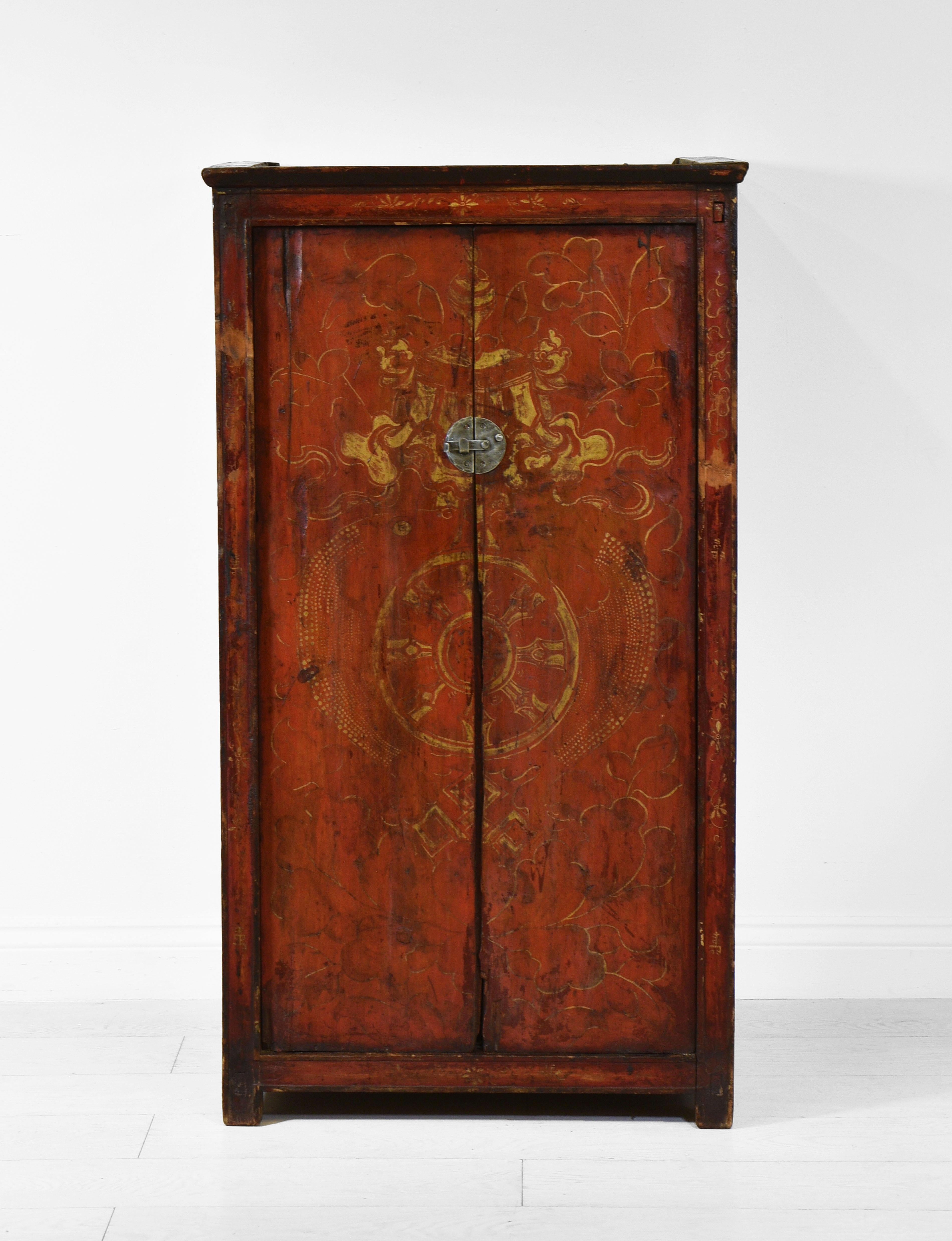A wonderful antique Tibetan or Nepalese painted rustic pine cupboard. Circa 19th Century.

The piece is hand painted with natural pigments, and the finish to the front has lovely warm tones.

The cupboard is of a good, deep design. The doors