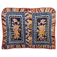 Late 19th century Tibetan saddle blanket with floral pattern in navy, pink, red