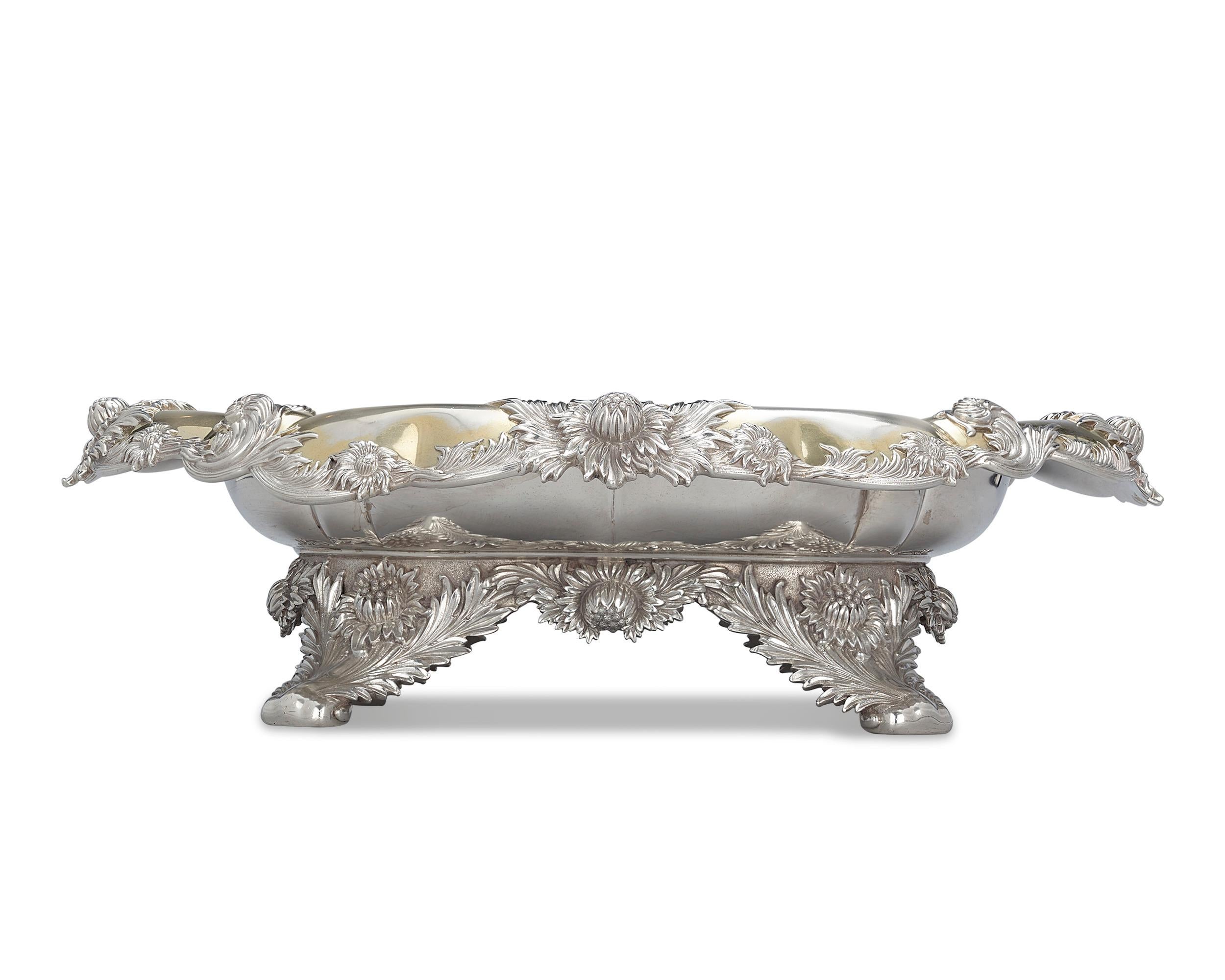 Dating to the first era of Tiffany & Co. silver production, this resplendent footed centerpiece boasts the exquisitely refined blooms of the Chrysanthemum pattern. Highlighting the form is a gilt wash interior that adds a layer of refinement to this