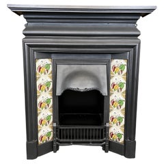 Combinación de chimenea de hierro fundido con azulejos del siglo XIX