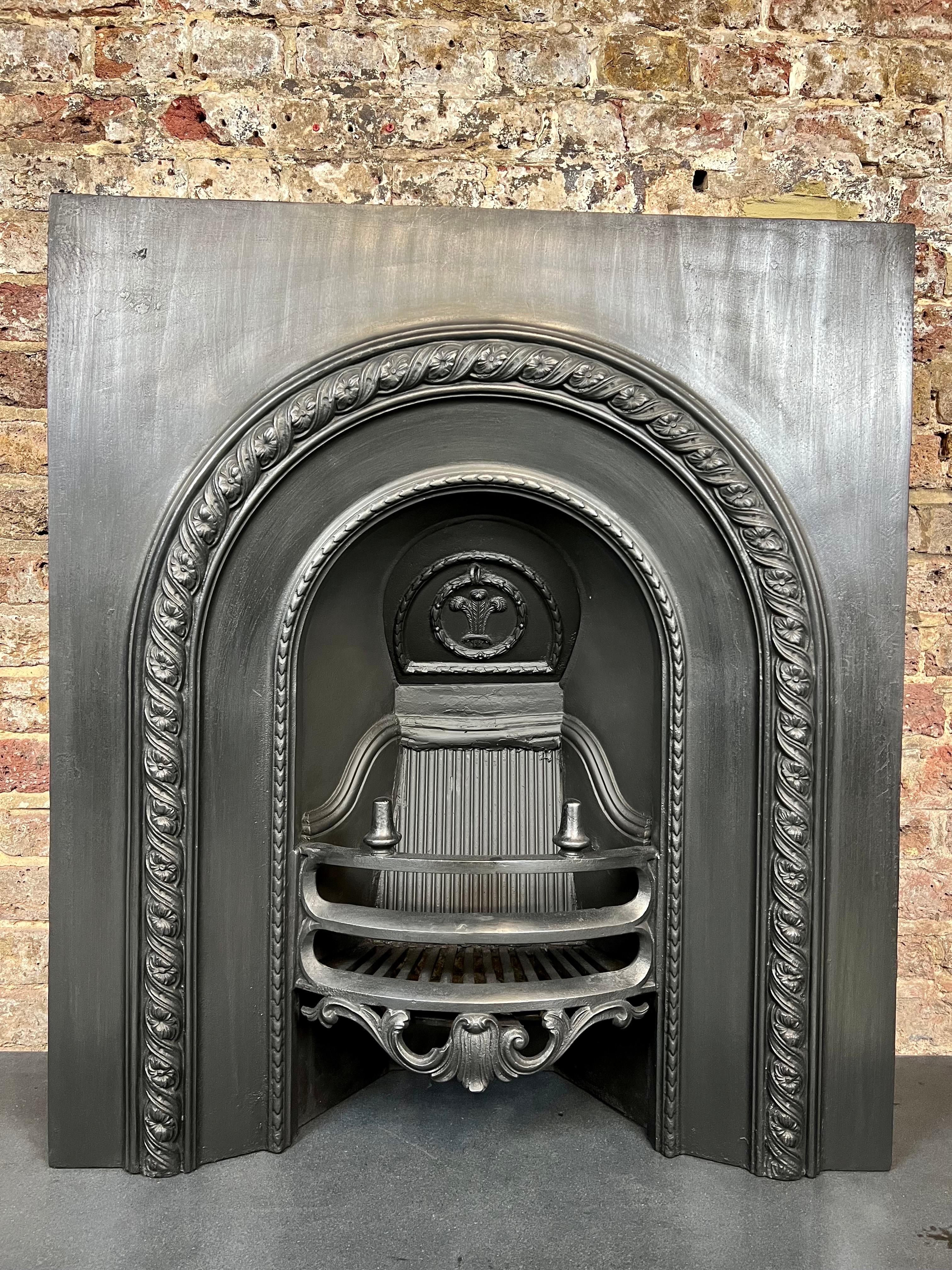 19th Century tiled cast iron fireplace insert.
Original victorian fireplace with Fleur-De- Lis Pattern on back, decorative front bars with two prominent spikes and Classice 
Arch rope design in traditional blackened.

Dimensions:
Width 32