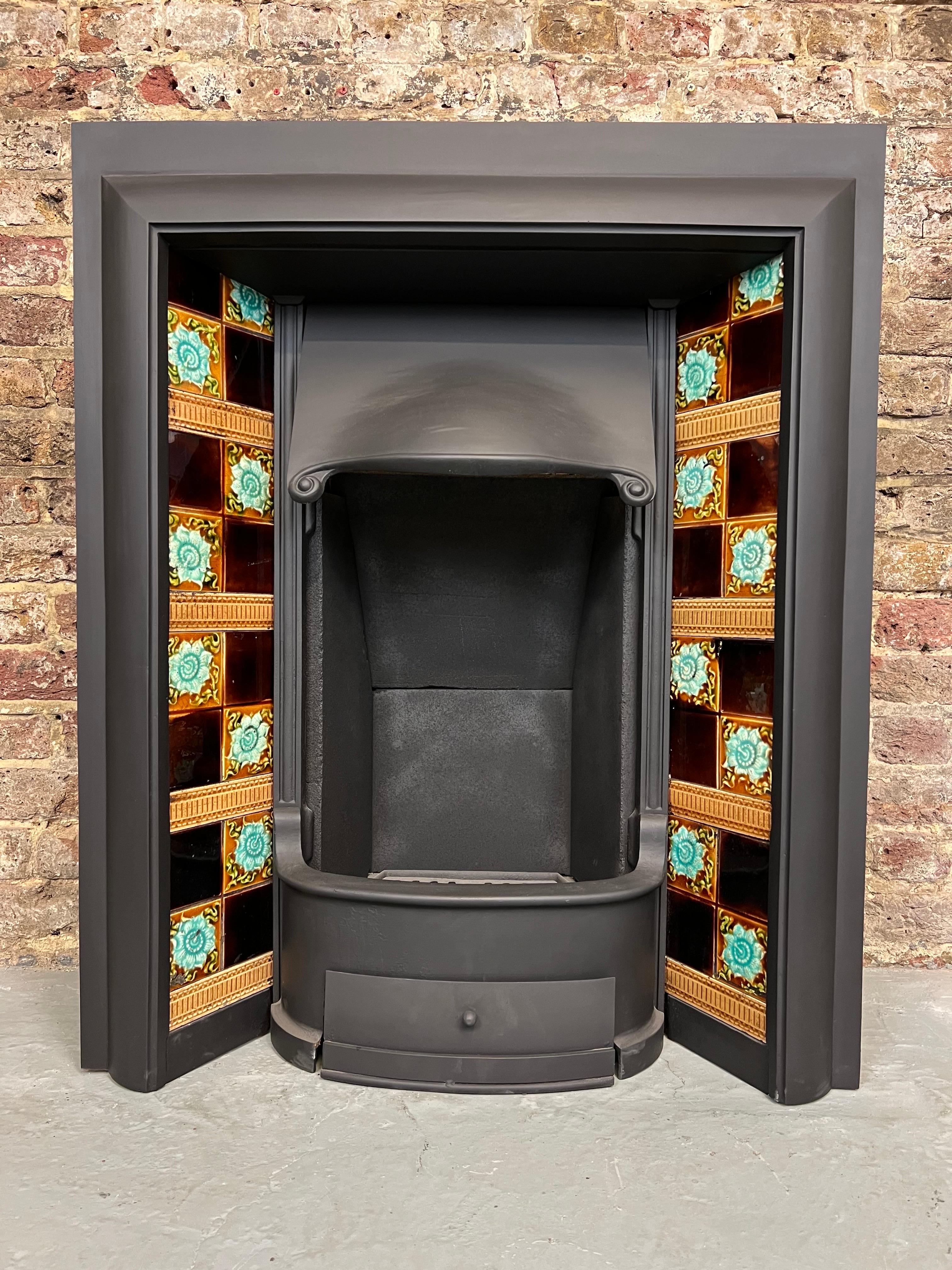 19th Century tiled cast iron fireplace insert.
With adjustable canopy hood, removable front bars, bottom grate & ash pan
including a very unique set of original hand painted victorian glazed ceramic tiles.
this fireplace insert is in traditional