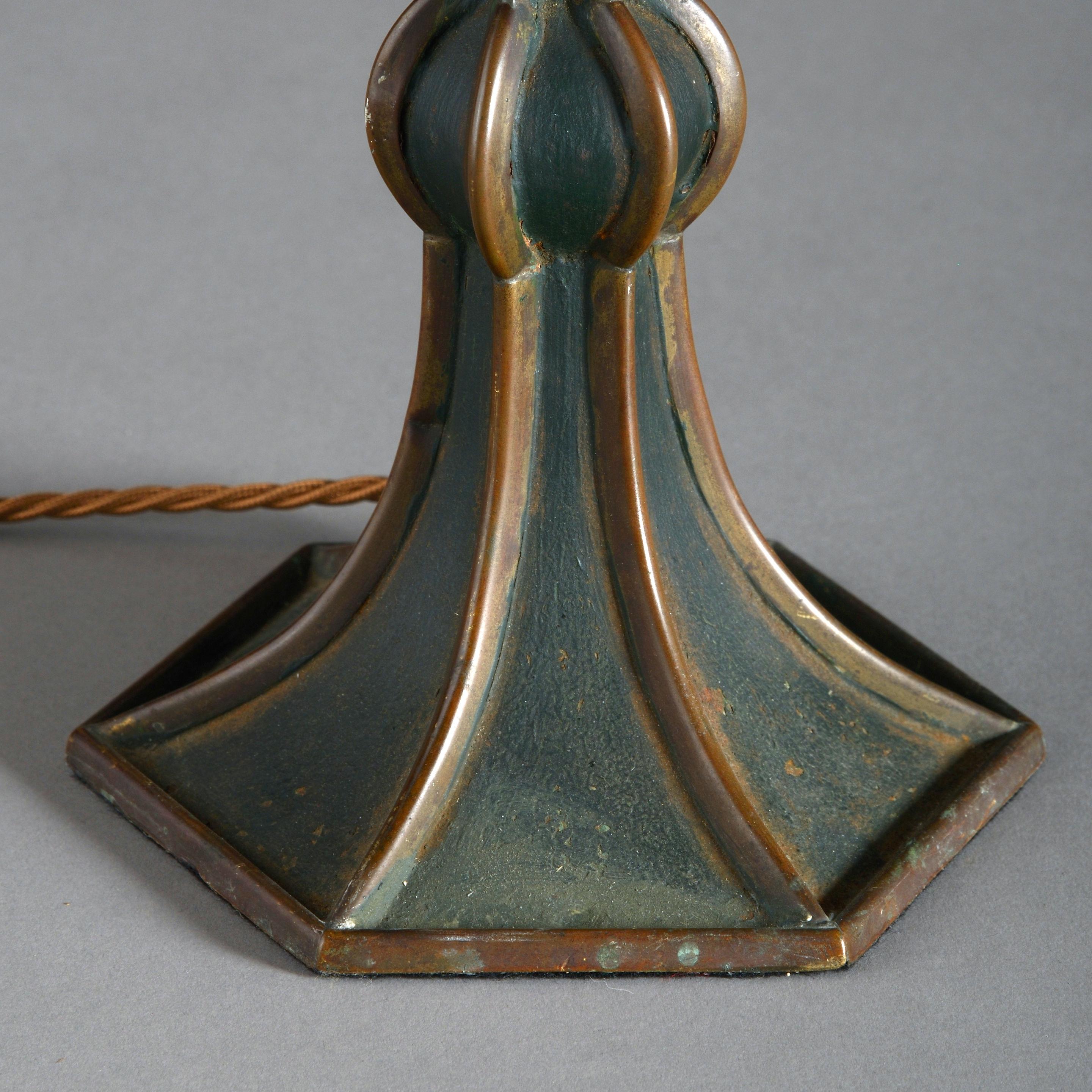 A green tole lamp base in the Moorish taste, of hexagonal form and retaining the original paint.