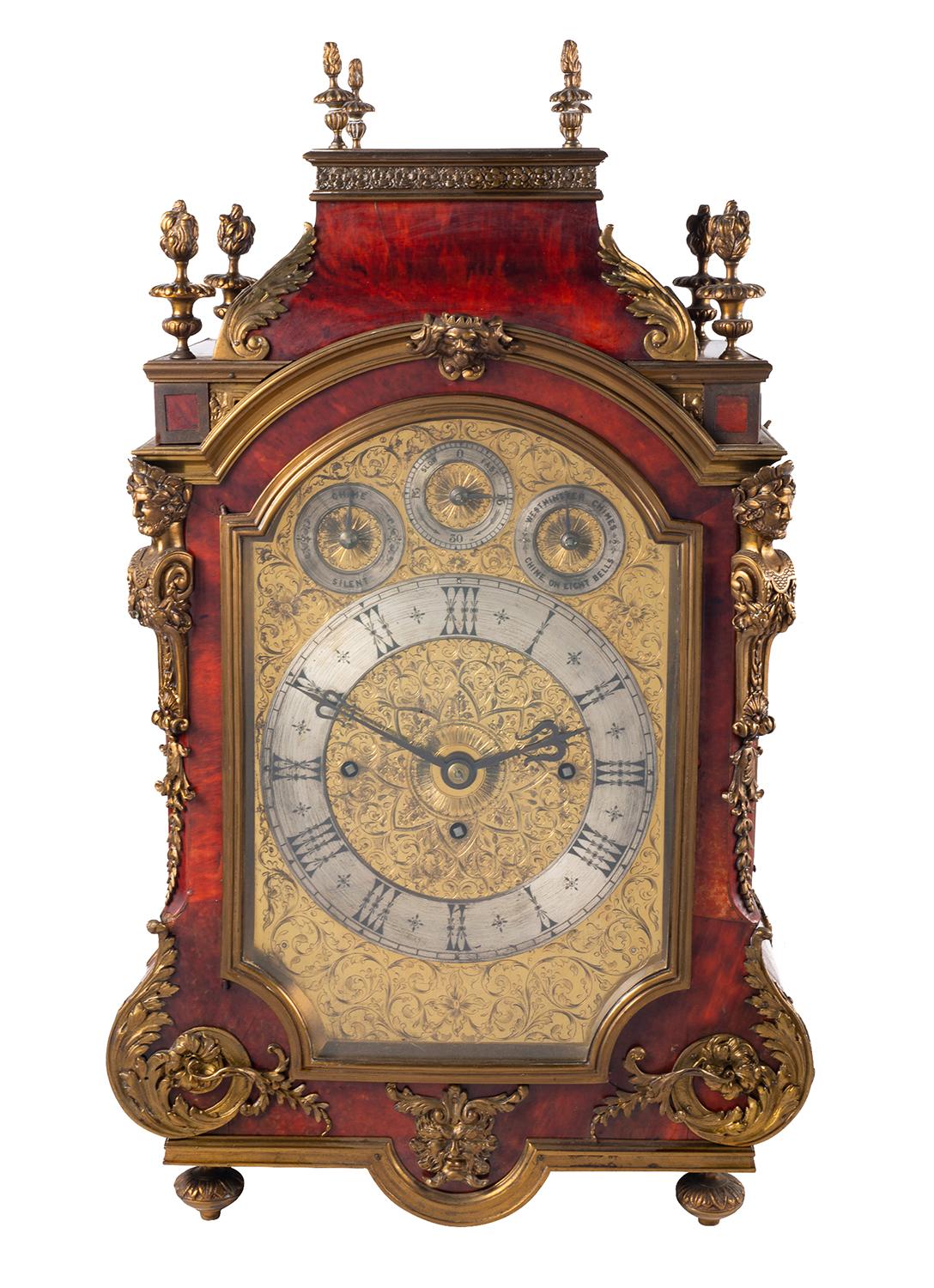 A very impressive and fine quality late 19th Century English bracket / mantel clock. Veneered in red Tortoiseshell and having wonderful gilded ormolu mounts and mouldings. Having flamed finials, pierced, fretted mouldings and panels, scrolling
