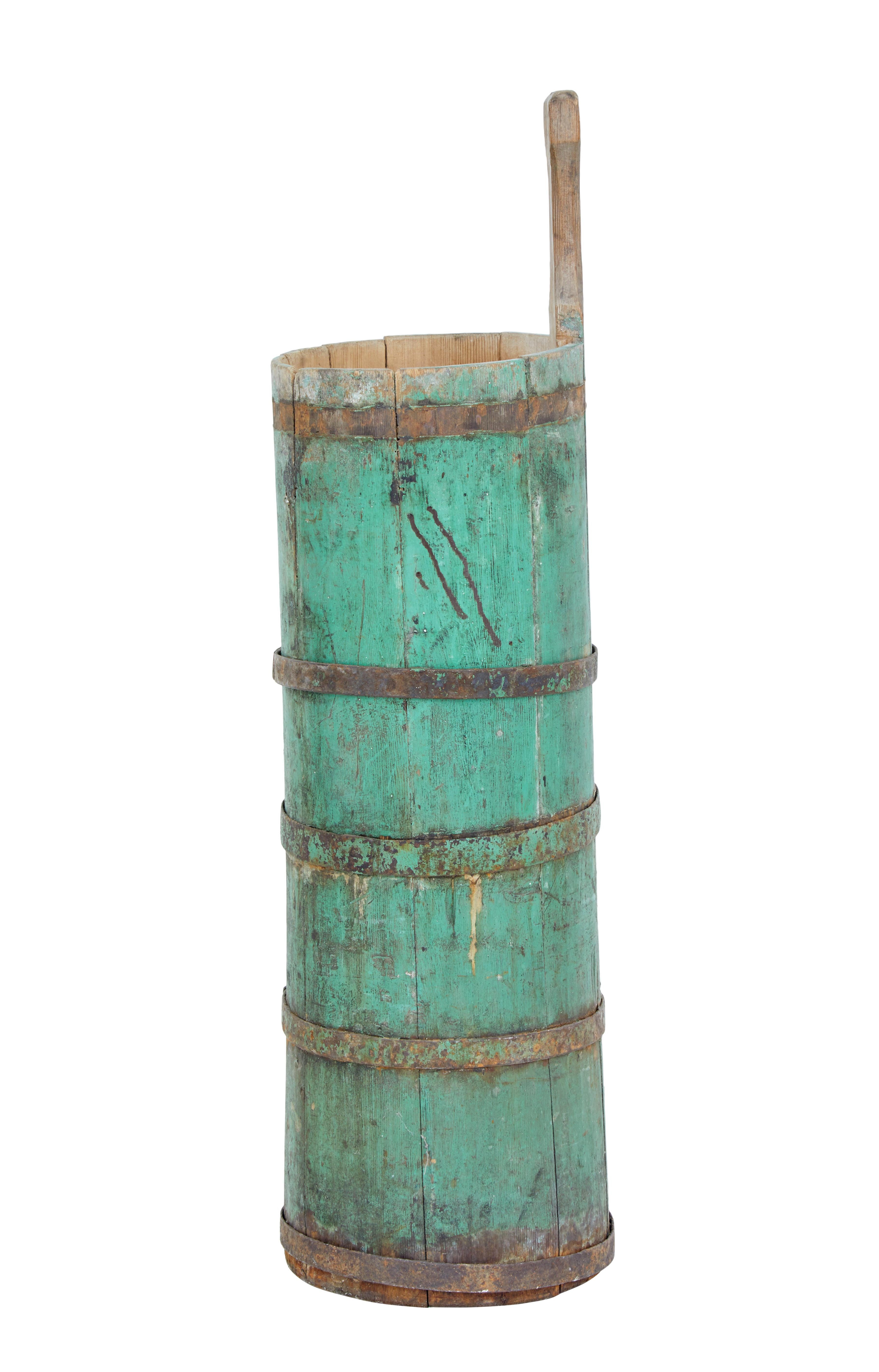 Here we offer a traditional Swedish pine butter churn, circa 1870.

Presented in original paint. Supported by 4 iron bands, 1 of which is missing. Ideal for use now as a perfect stick or umbrella Stand.

Obvious losses to original paint,