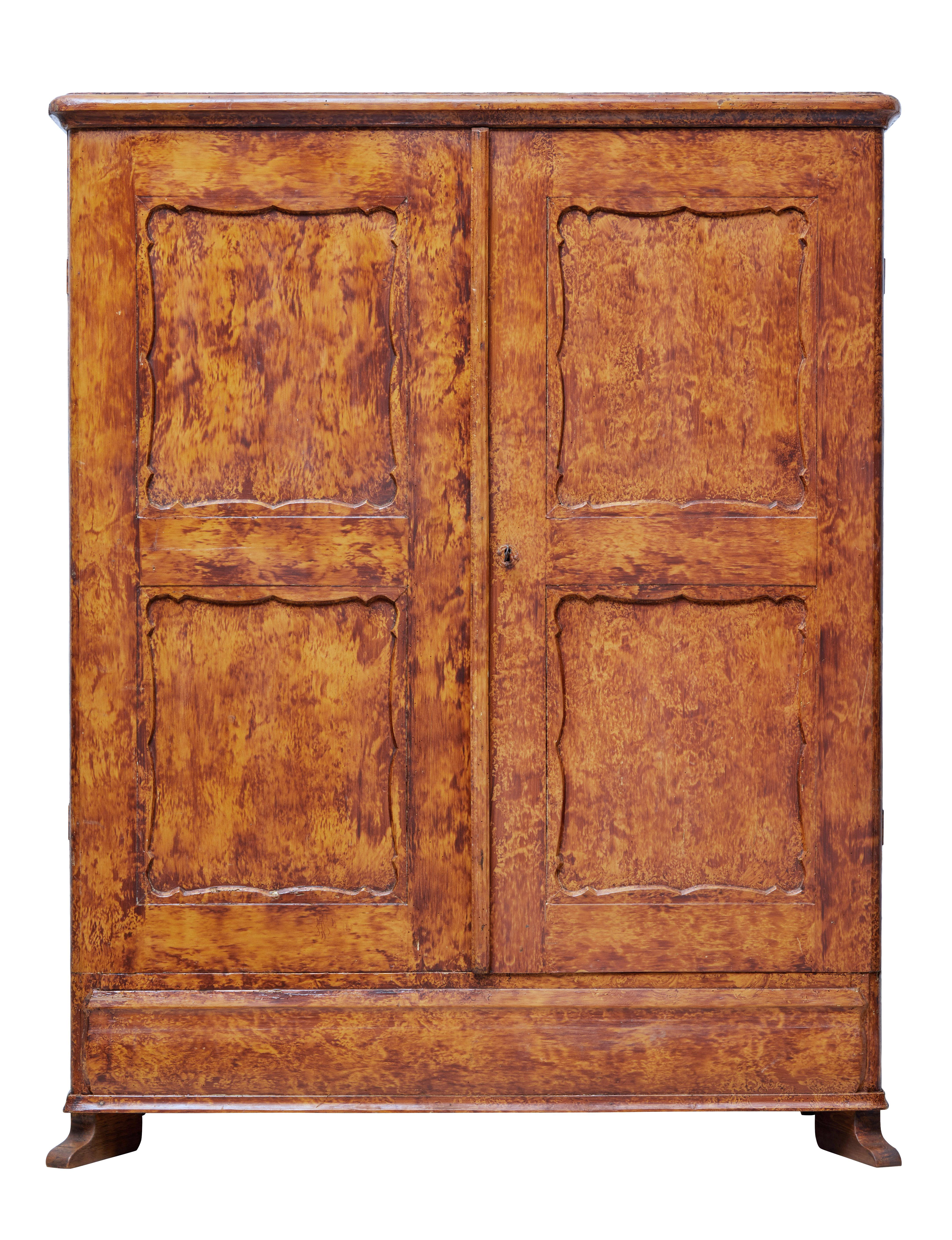 Good quality traditional Swedish cupboard, circa 1870.

Presented in its original ragwork paint effect. Double doors open to reveal a partially fitted interior which indicates this was being used as a wardrobe.

2 shelves and 4 drawers, also an