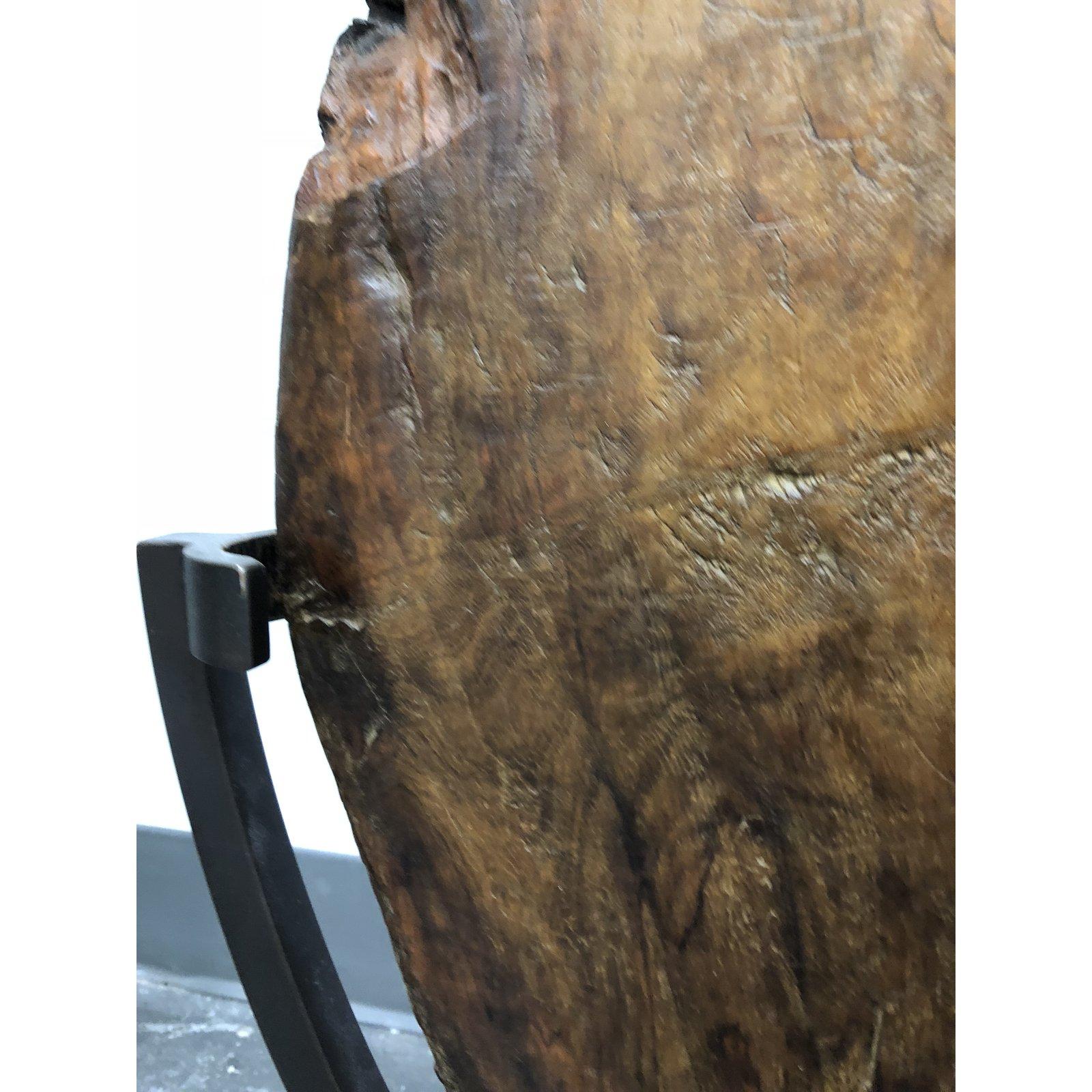 An antique cart wheel made of Narra wood, a commercially extinct hardwood with dense grain. Repairs made in iron are from the early 20th and late 19th century. Such wheels, fitted with iron rims were wheels on carts bringing agricultural goods to