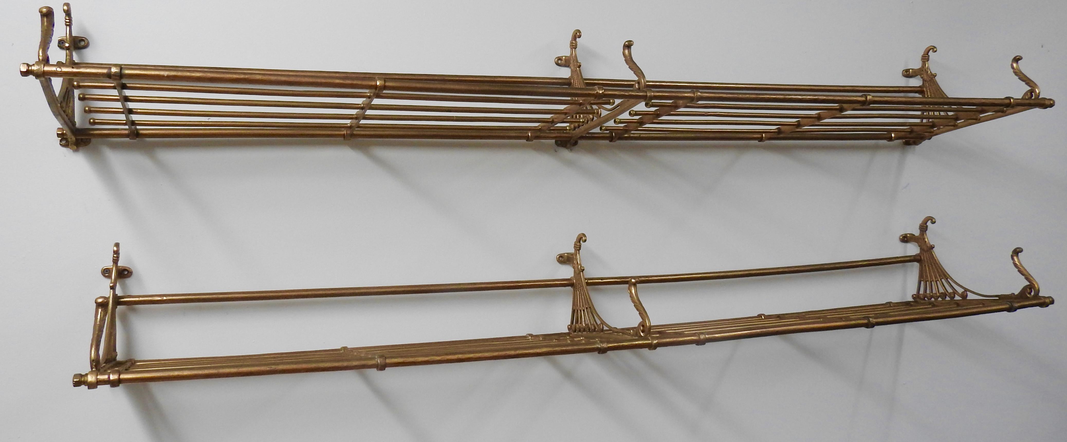 We are featuring a beautiful pair of antique brass train car luggage racks from the late 19th century. The patinated brass is consistent with age and use of the luggage racks. The rack features an open, tubular shelf supported by three wall-mounted