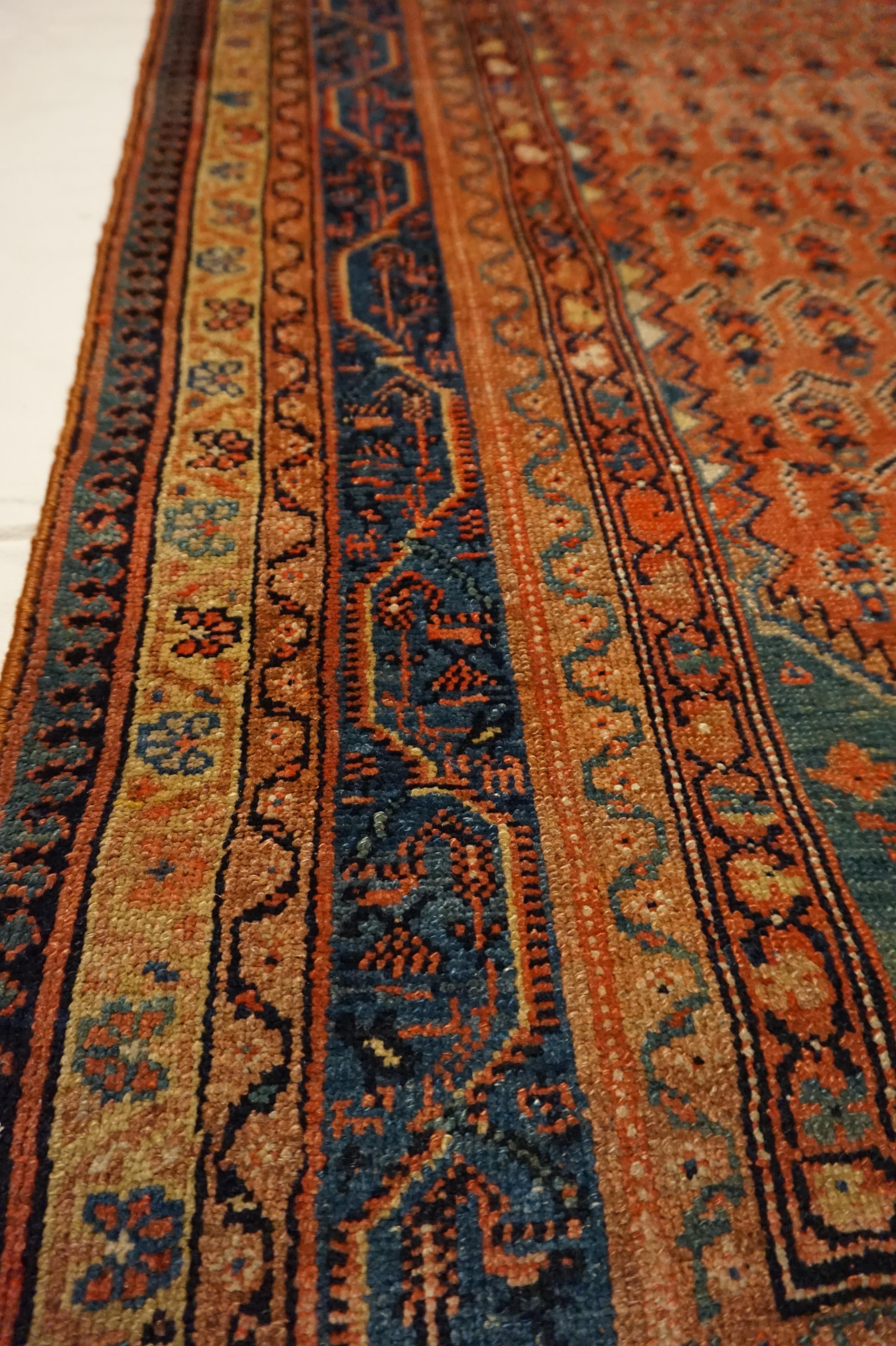 Wool 19th Century Tribal Boteh Paisley Hand-knotted Rug In Rust Hues For Sale