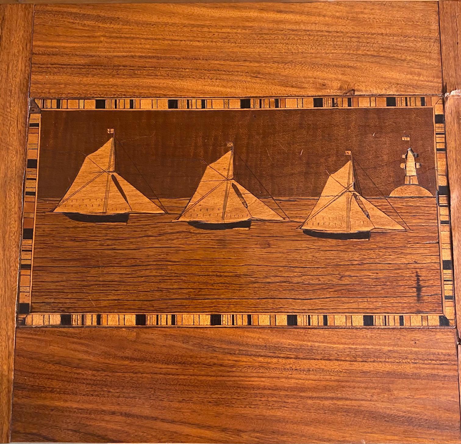 Fine 19th century trinity house marquetry inlaid rosewood sewing box, circa 1870, made by a Trinity House Lighthouse Keeper or sailor aboard a Lightship for sale to passing ships. The rosewood box features marquetry inlaid cutter-rigged sloops