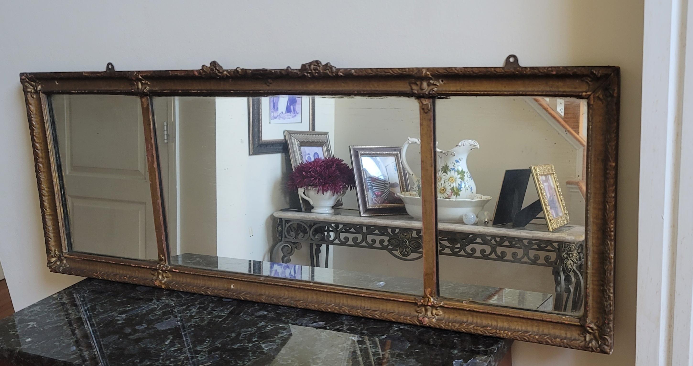 A gorgeous 19th Century Trisection Ornate Giltwood Overmantel Fireplace Mirror measuring 50.5