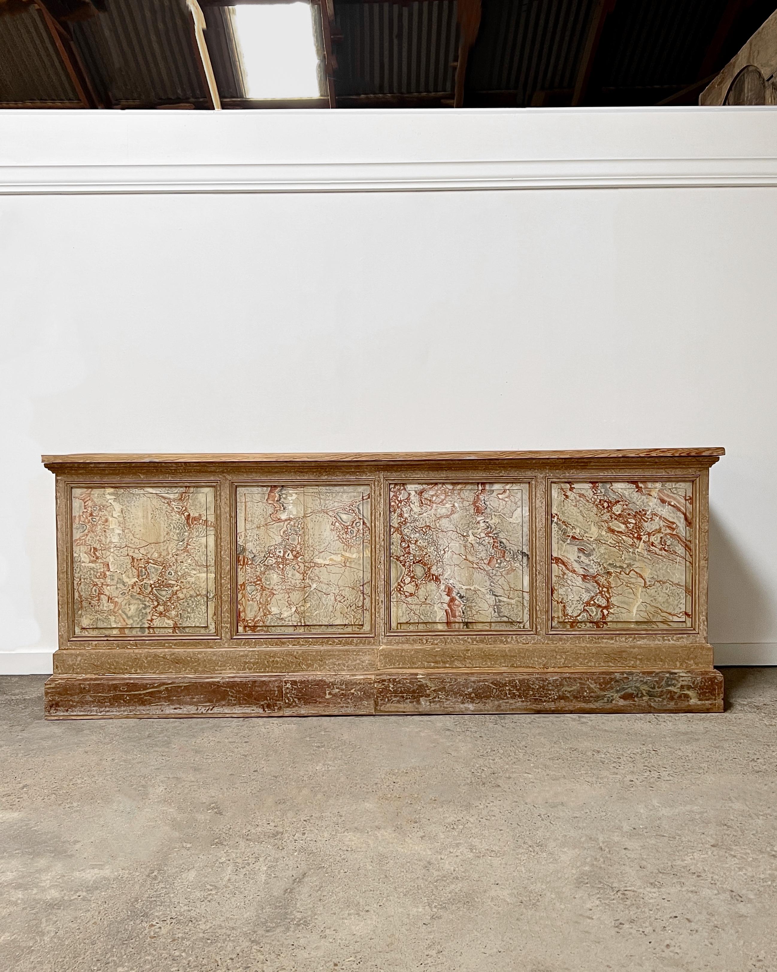 Found in London, this old Victorian-era shop counter is a beautiful, one-of-a-kind, statement-making piece that will add a sense of history to your home’s story!

A wonderful faux paint finish decorates the frame and decorative beveled molding of