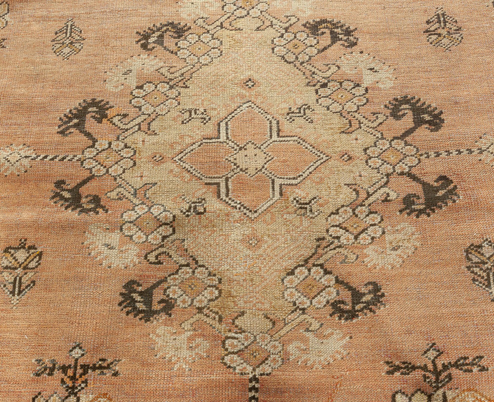 19th century Turkish Ghiordes beige handwoven wool rug
Size: 11'9