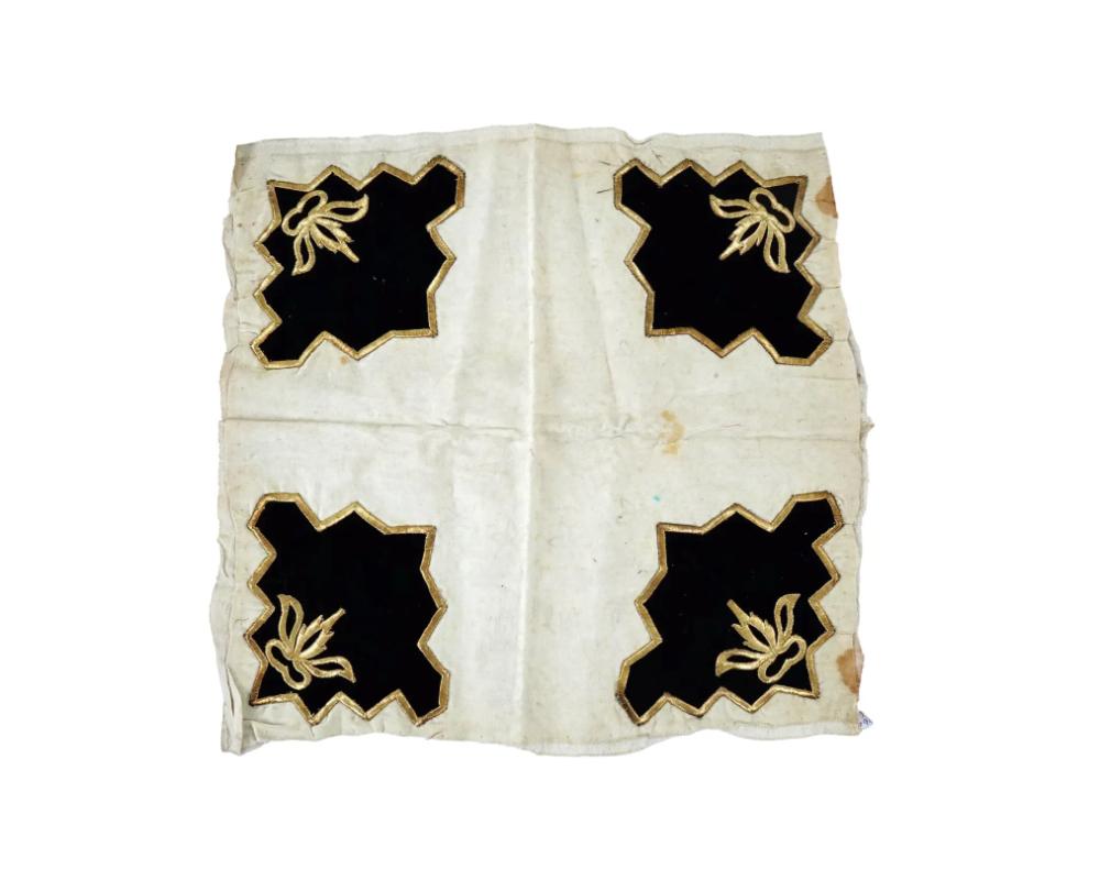 An antique Turkish hand embroidered cotton textile. The textile is decorated with an ornate design representing four black velvet panels featuring a gold threaded foliate scroll ornament and rims. Circa: 19th century. Antique Turkish Islamic