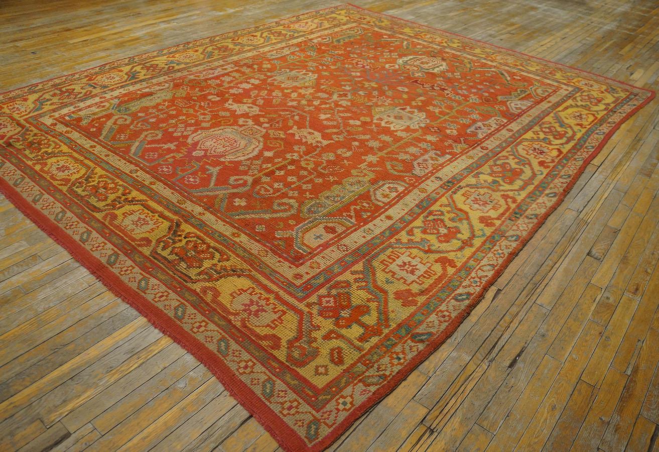 19th Century Turkish Oushak Carpet ( 9' x 11' - 275 x 335 ) 
Four giant light blue palmettes in an extended cross-pattern dominate the tomato-red field of this circa 1900 Oushak carpet in the Persian Heriz style. Formal plants and vines fill the