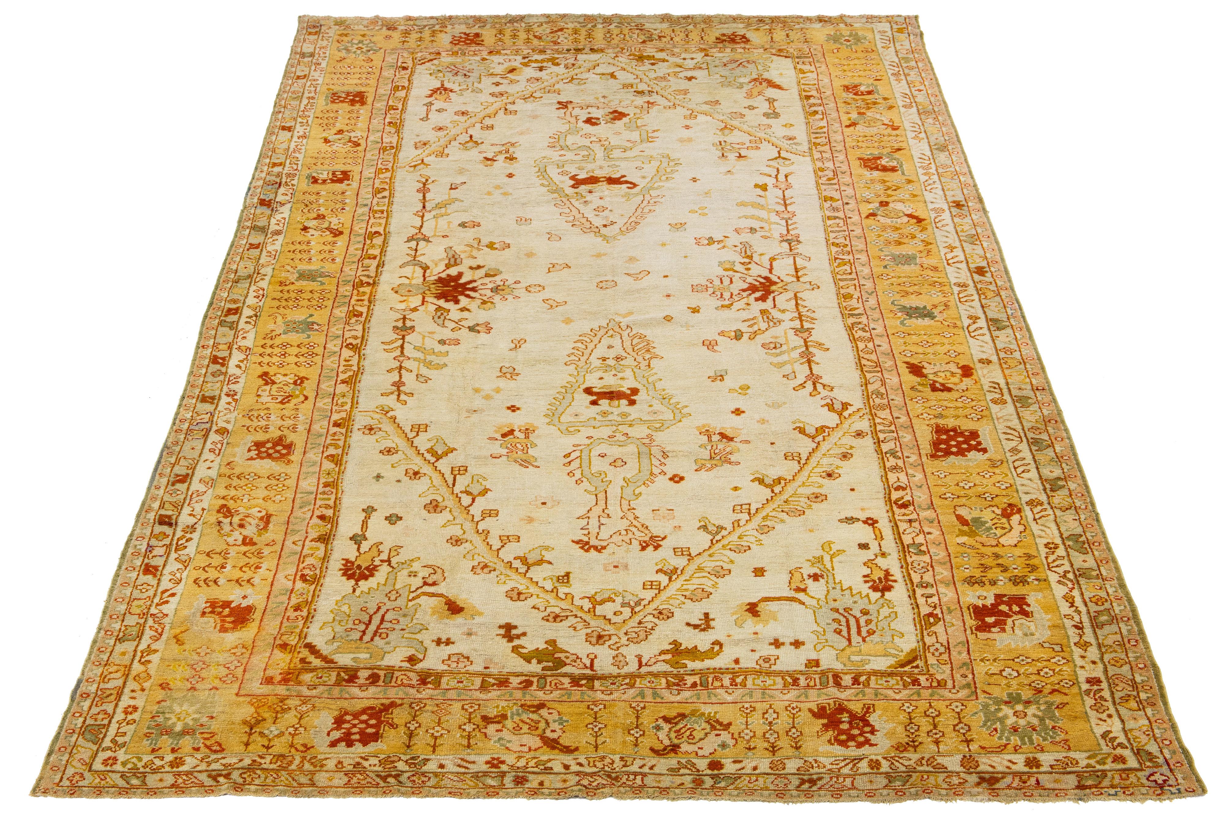 This antique Turkish wool rug is exceptional with its charming beige base color and meticulous hand-knotted craftsmanship. It showcases stunning yellow-gold, green, and red accents, displaying a captivating floral pattern.

This rug measures 9'9