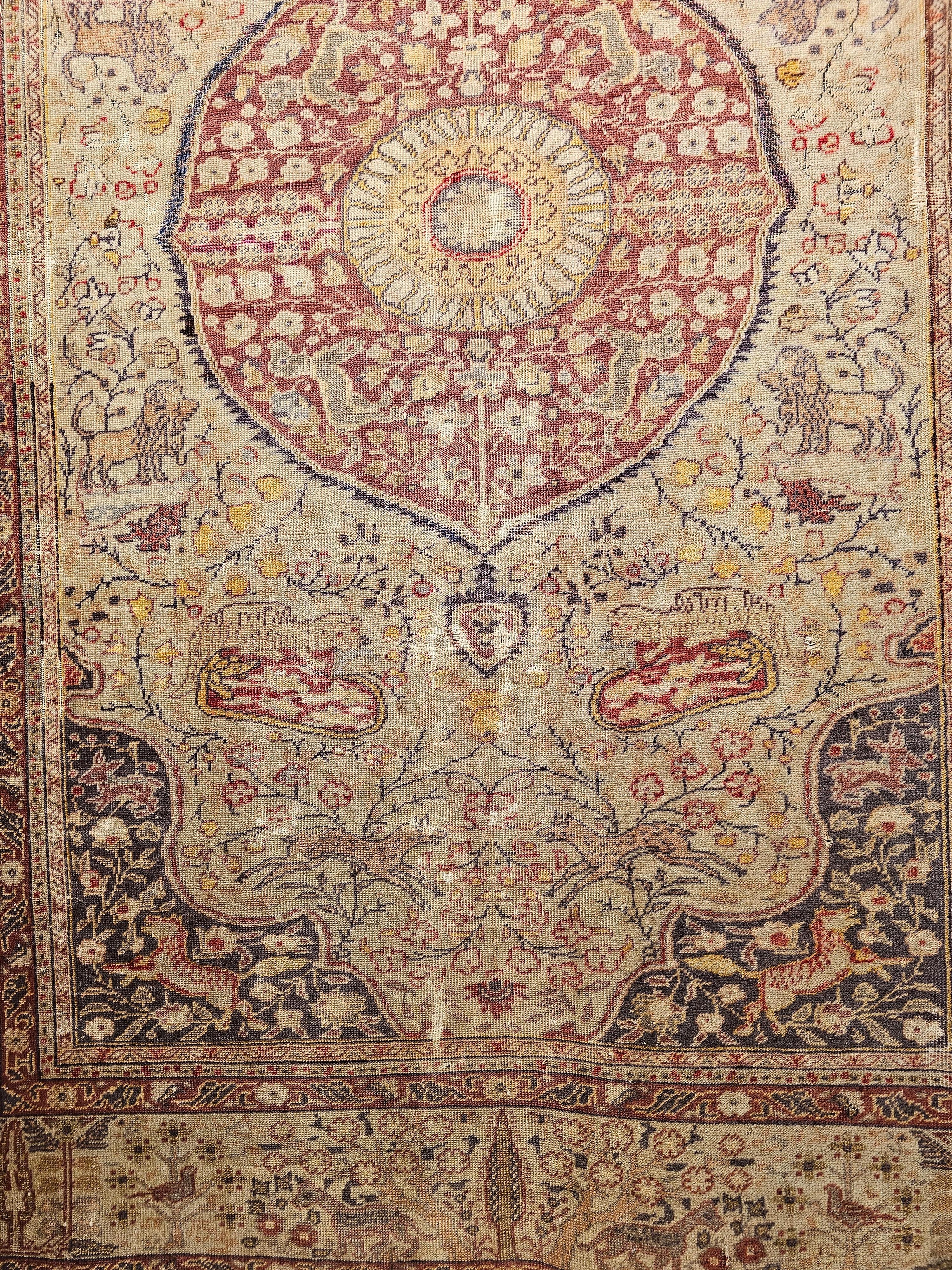19th Century Turkish Sivas Area Rug with Floral and Fauna Design in camel, red, and lavender colors.  The rug is in the garden design with animal figures including deer, lion, and birds.  The overall design is simplistic but very charming.  The