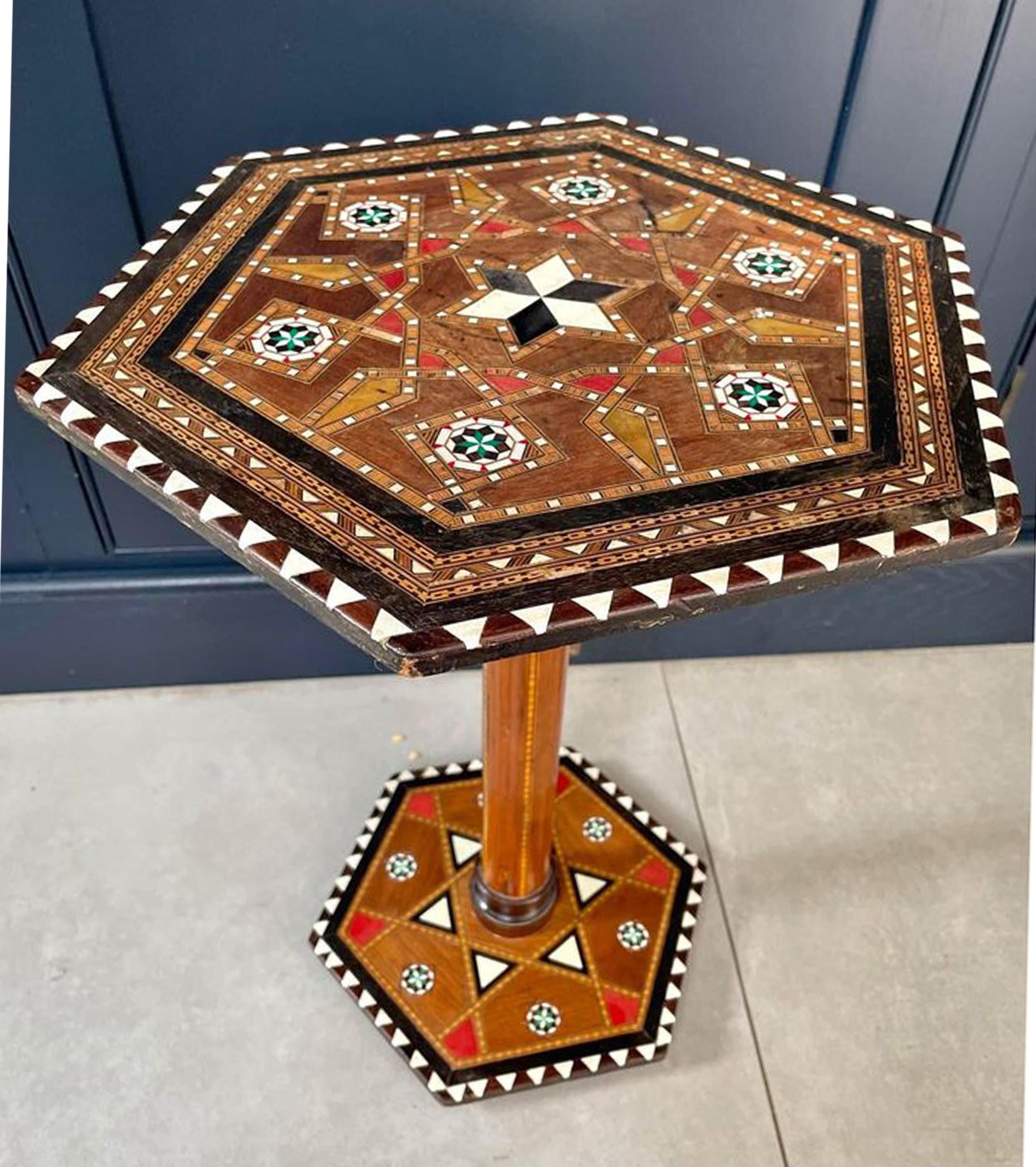 Beautiful 19th Century Design Hexagonal Moorish Fruitwood Tea Table With Parquetry Detailing 

Decorative Throughout With Beautiful Geometric Repeating Parquetry Patterns.

Finished With Ebonised Accents On A Decorative Hexagonal Platform Base. 