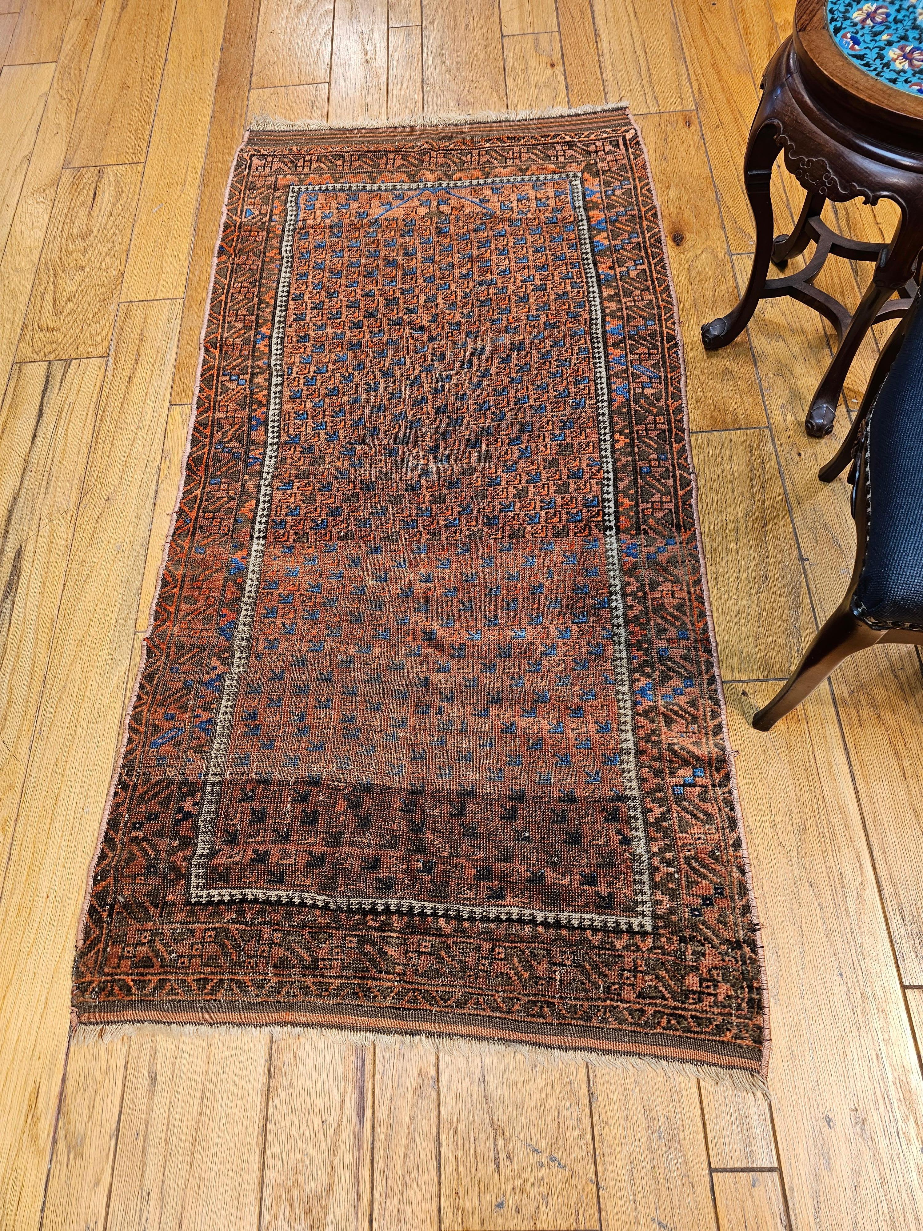 19th century Turkmen Yomut tribal rug from Central Asia in a geometric design pattern in dark red with accent colors in French blue, brown, and ivory.   This Turkmen Yomut is one of the finest tribal weaves from the late nineteenth century. The