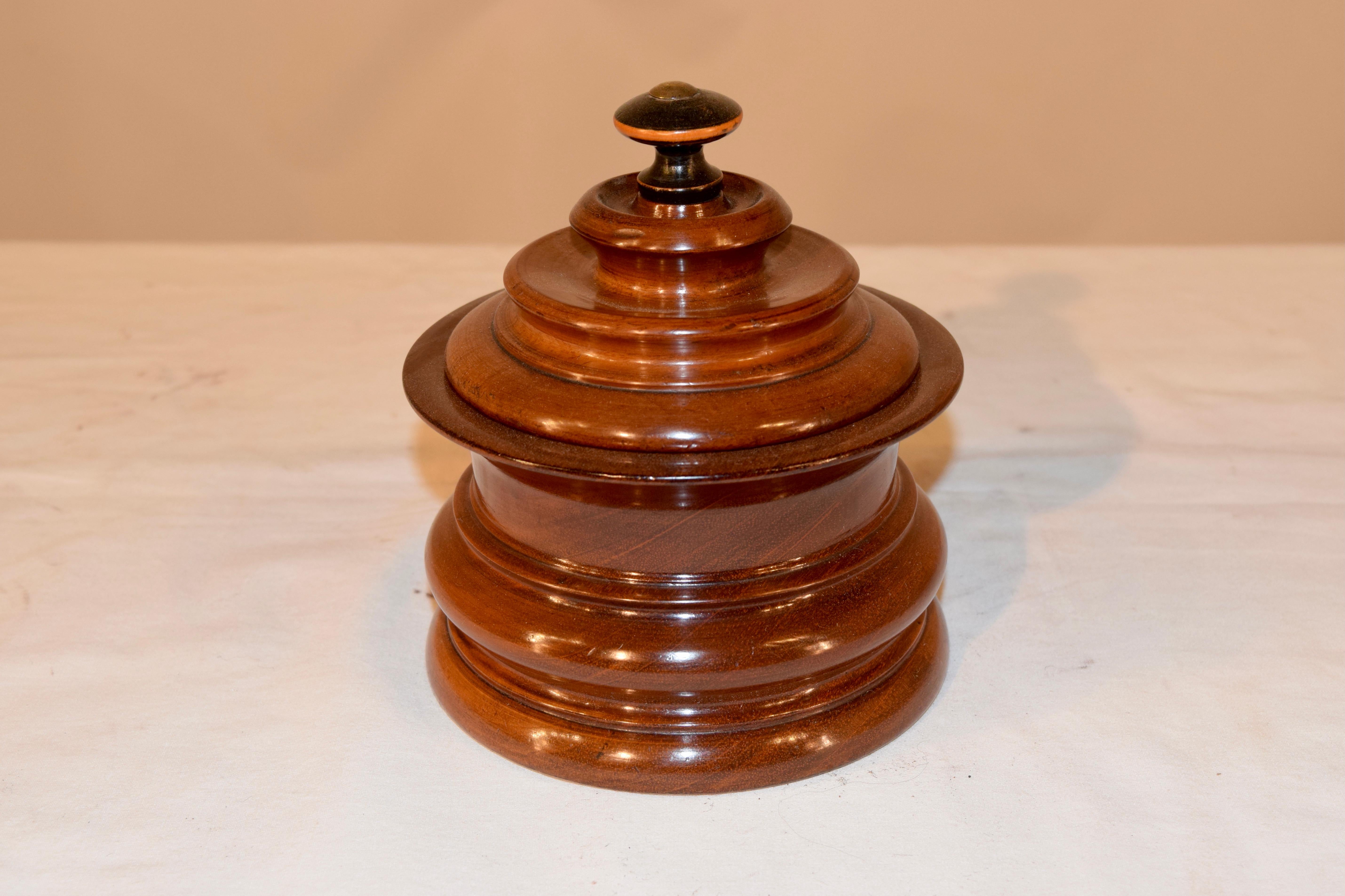 19th century turned walnut humidor with lovely shaping and retaining the original interior press.