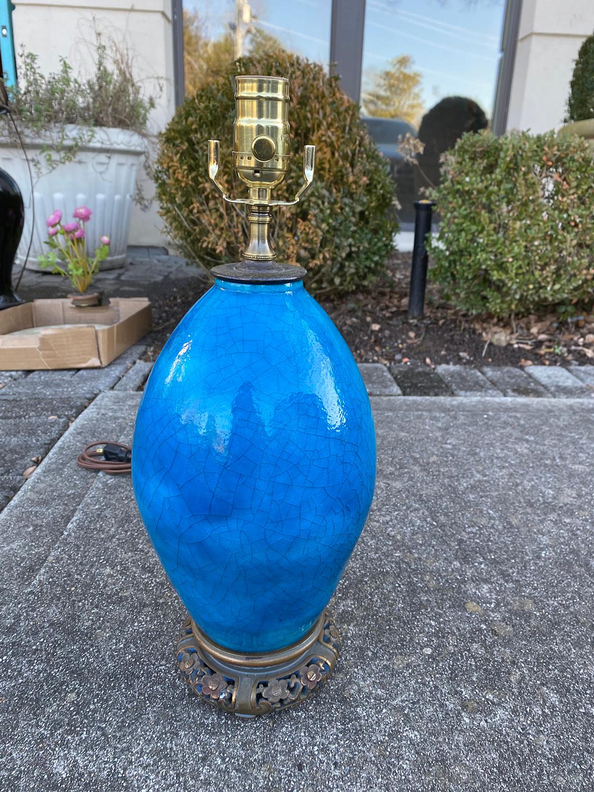 19th century turquoise blue crackle glaze bronze mounted porcelain table lamp on wooden base.