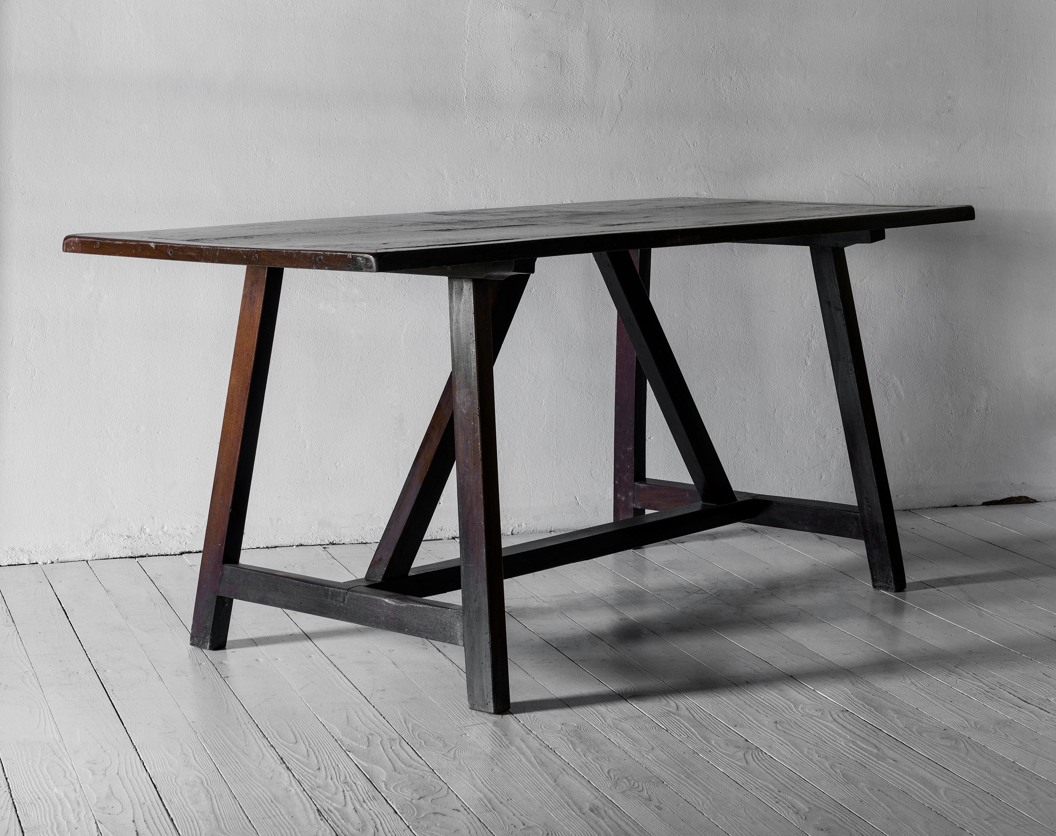 A beautiful desk, library table or console table possibly having been used as a writing desk. Great sculptural presence, works wonderfully in a contemporary or classic interior. We are particularly fond of this design in its almost Asian simplicity.