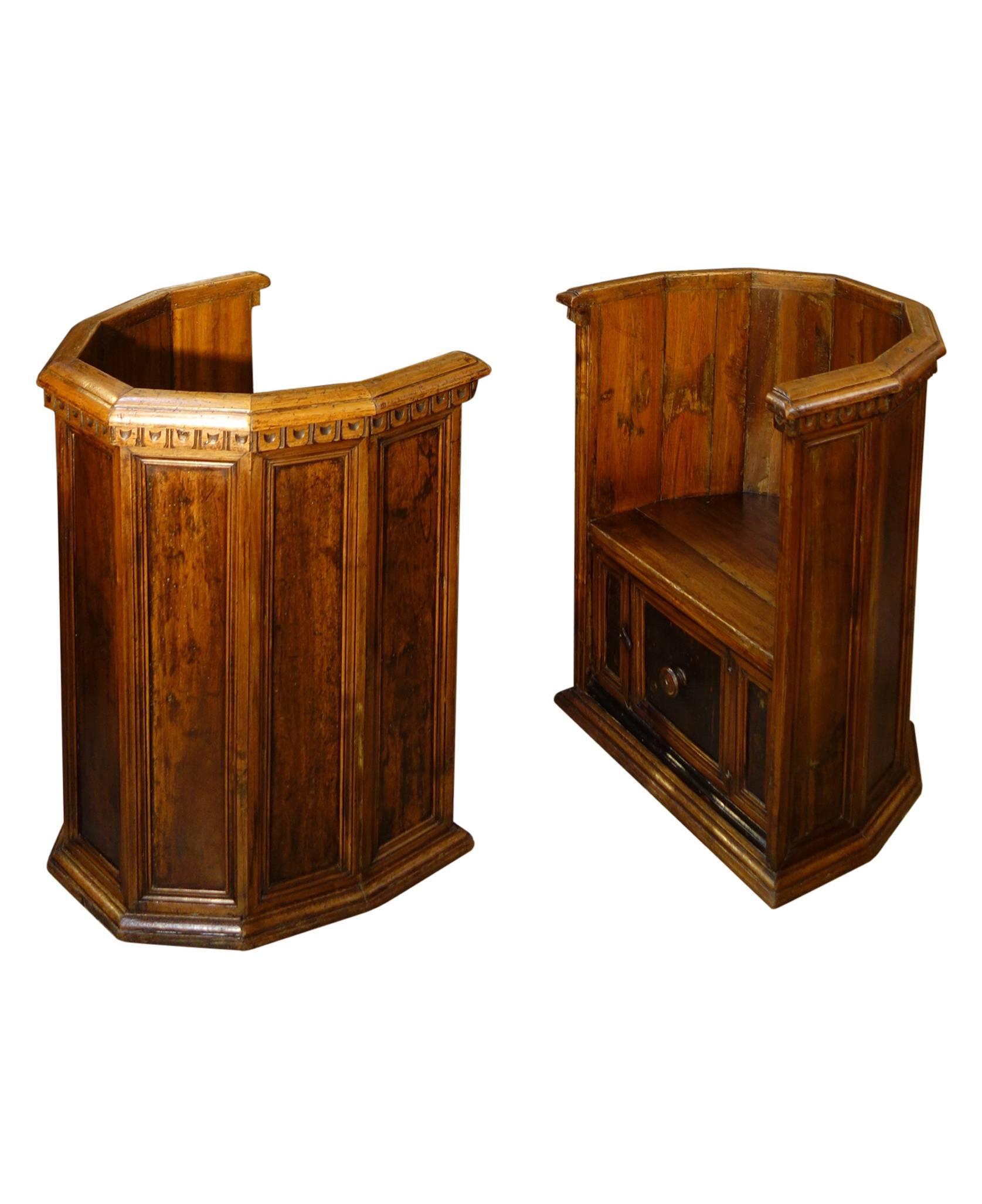 Pozzetto shape 15th Century Style Florentine room chairs.
Rare, hand-carved walnut Italian polygonal-shape chairs with seven panel back segments and hinged door revealing storage beneath the seat. Original design from the 1400s. Similar to one in