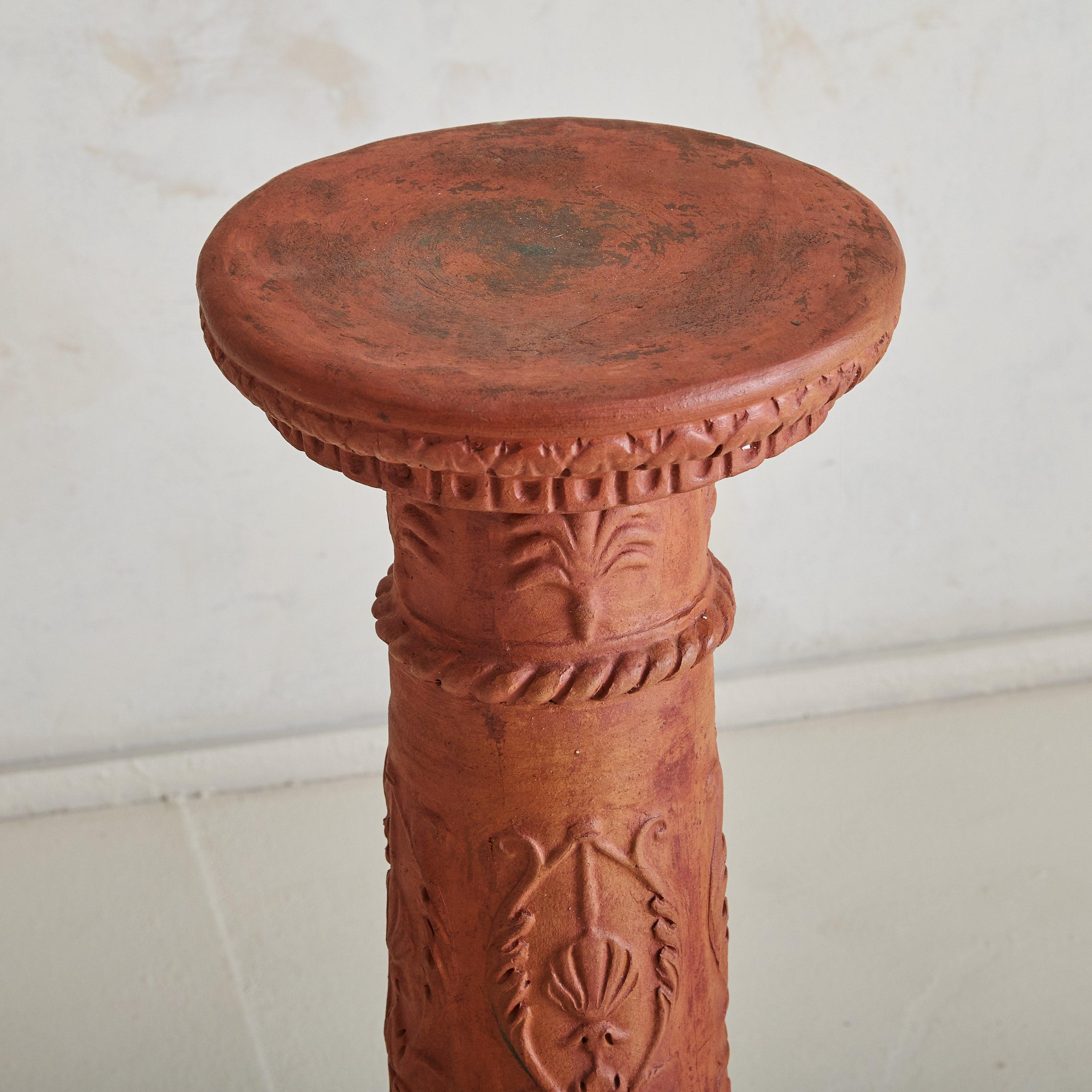 One available / one sold.

This 19th-century Tuscan terracotta column captures the enduring elegance of Italian craftsmanship. Intricately hand-carved with botanical motifs, its rich patina carries the warmth of its storied origins. With a fluted