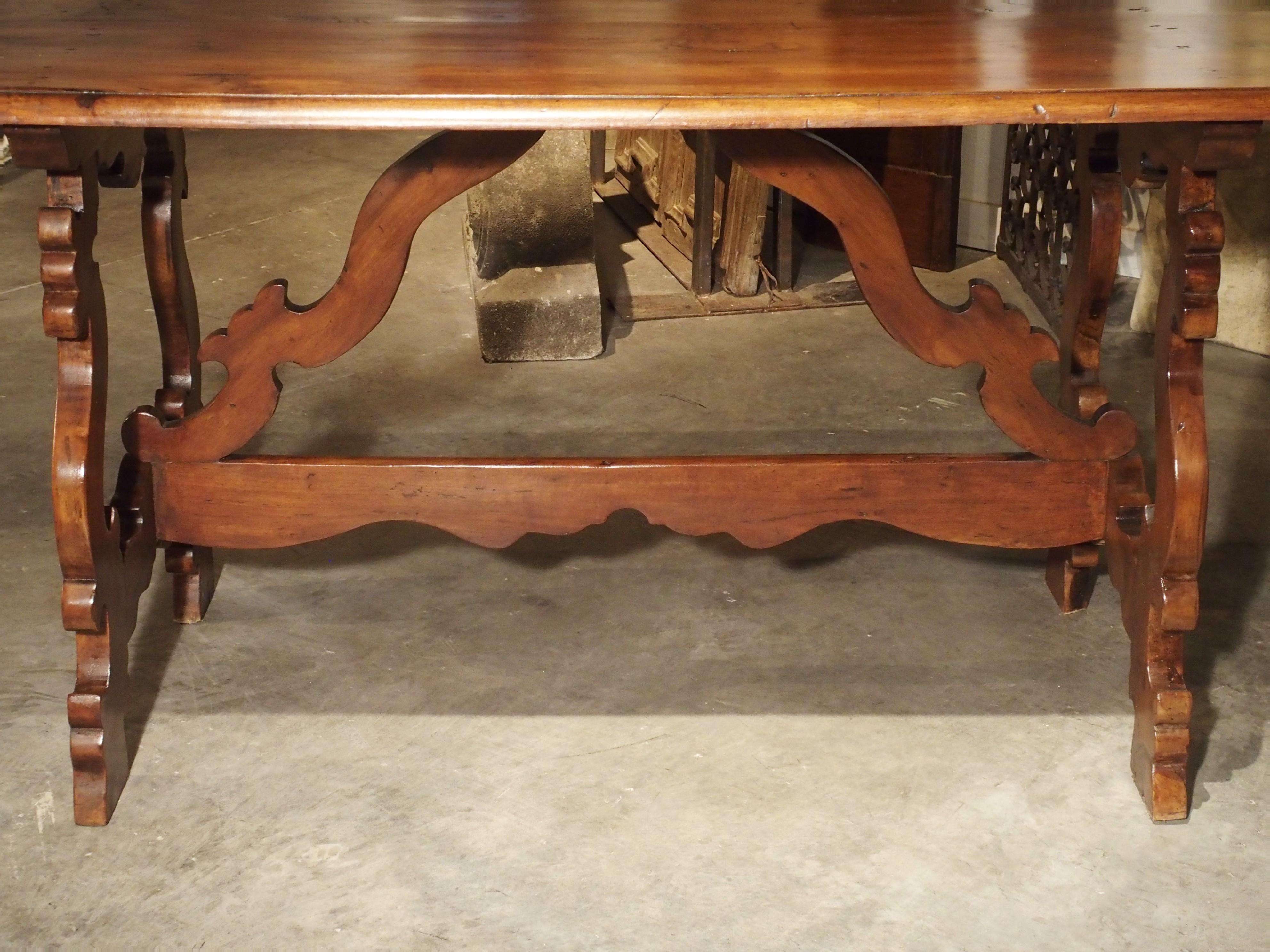 Italian 19th Century Tuscan Walnut Table with Shaped Wooden Stretchers