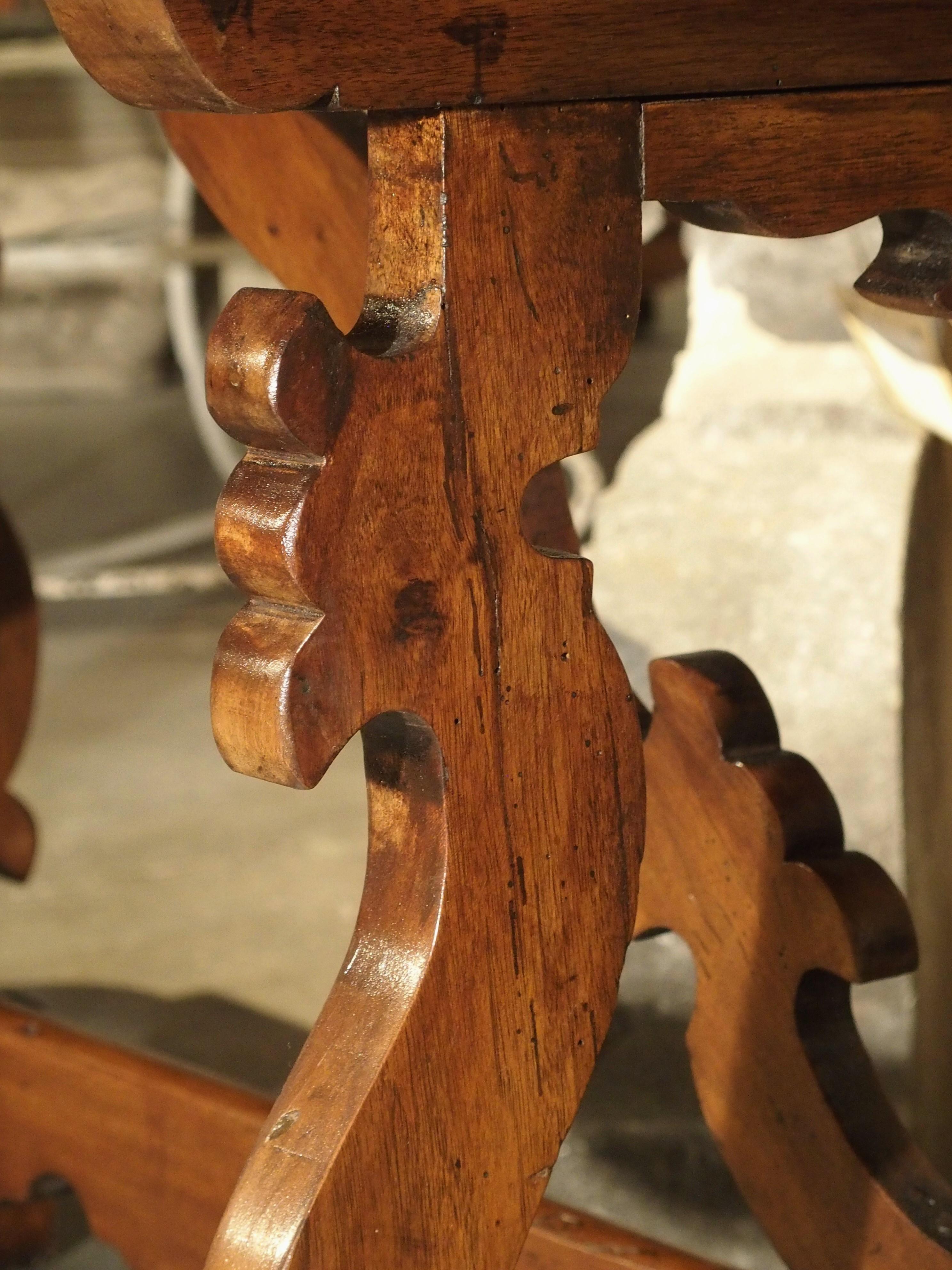 19th Century Tuscan Walnut Table with Shaped Wooden Stretchers In Good Condition In Dallas, TX