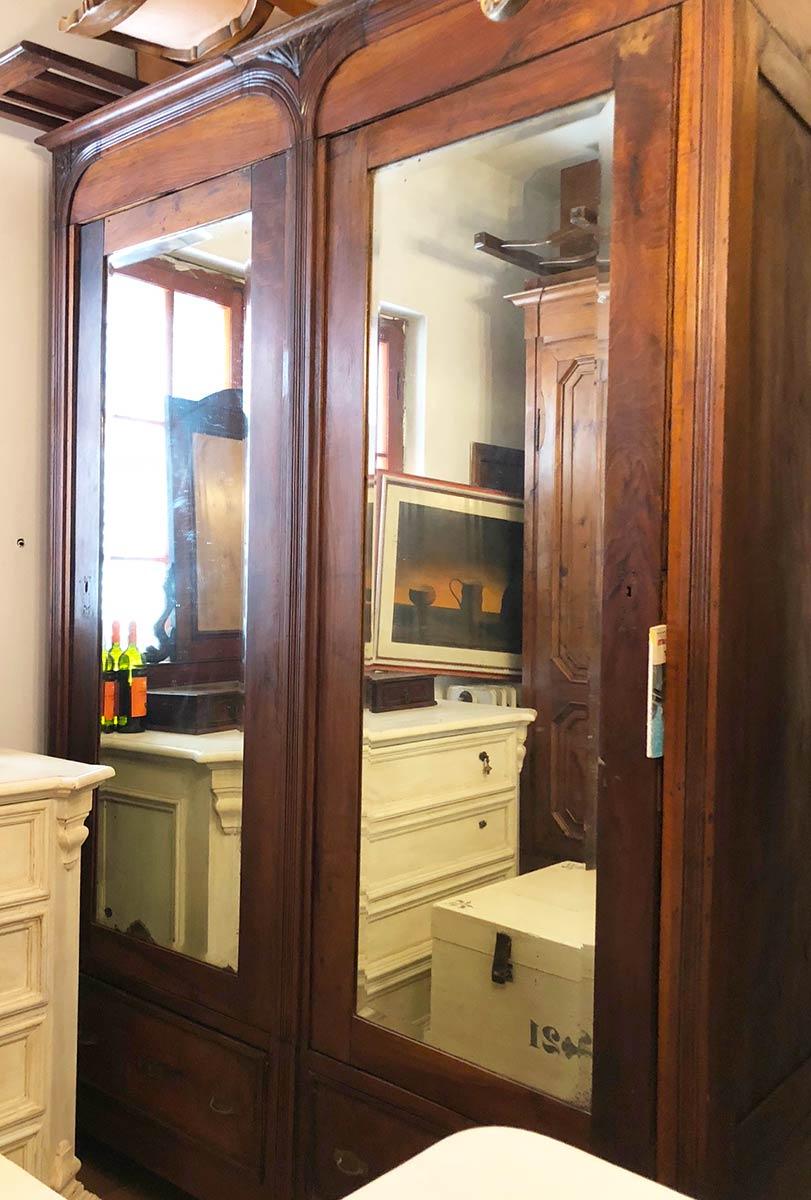 1880s  two-door Tuscan wardrobe
Original ground mirrors, in national solid walnut, removable, with internal and external drawers, rarity for size and quality.
Size (cm): 166 + 6 (frame) x 60 x 245 H.
The cabinet can be disassembled into main pieces
