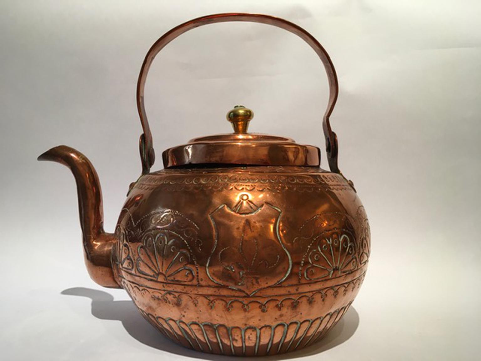 This is an original artcrafted piece made in Florence Tuscany, Italy in the circa 1890. There is the Florentine lily engraved.
The copper kettle shows all signs of the time, but it don't lose its charm.

The piece shows irregularity and hits but it