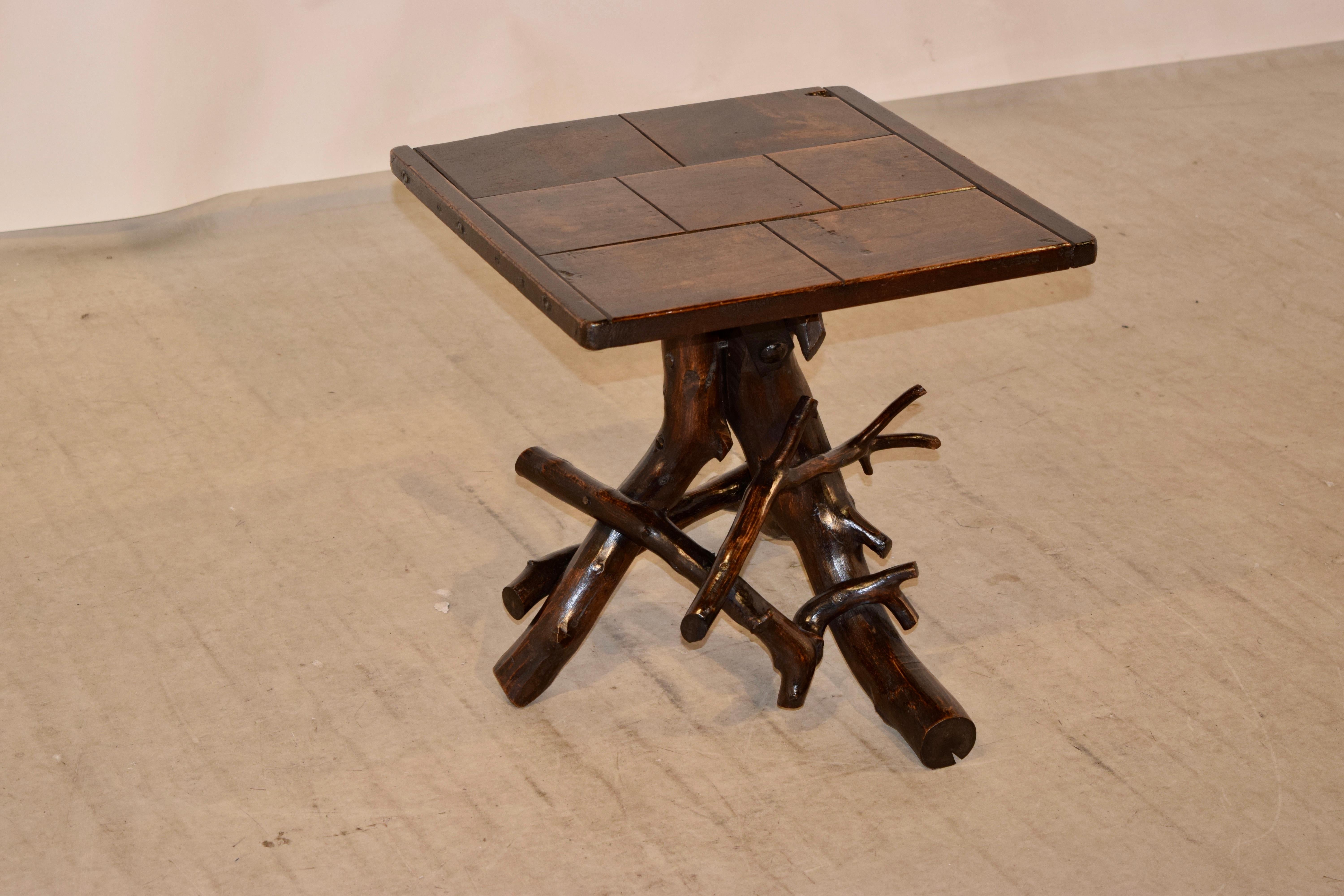 19th century French side table with a parquet top which is banded on the ends and supported on a base made from grapevines.