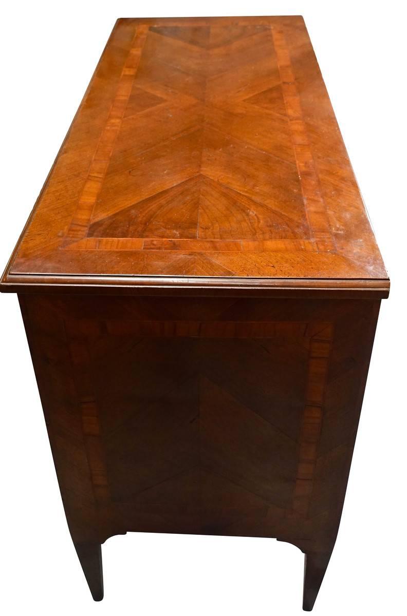 19th century Italian two-drawer commode with decorative inlay detail.
Walnut wood.
 