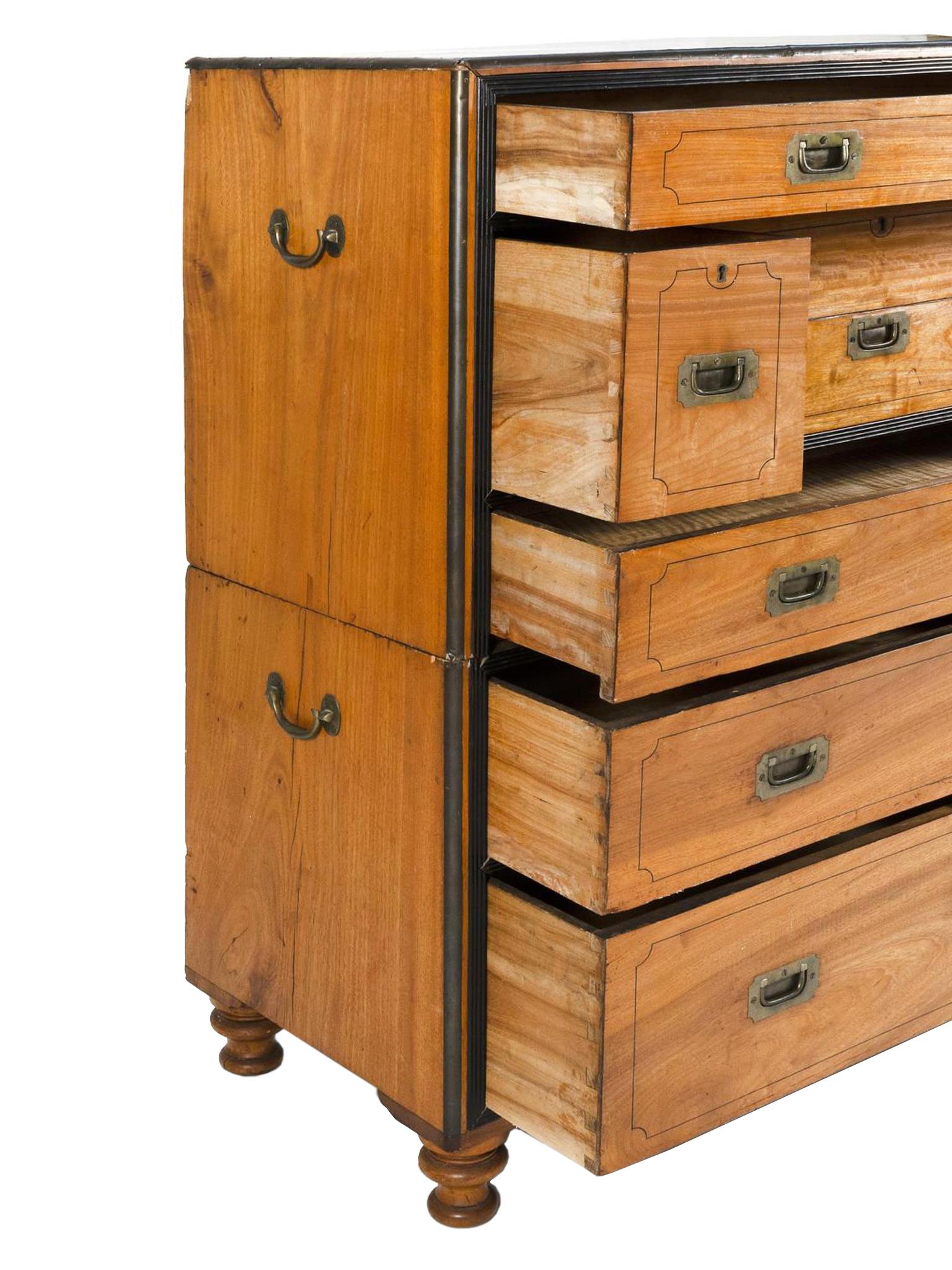 This exceptional Campaign chest of drawers was crafted by a Hong Kong-based cabinet maker in the 19th century. The woodwork is impeccable with the chest constructed in two parts: a lower chest and an upper chest that can be transformed into a