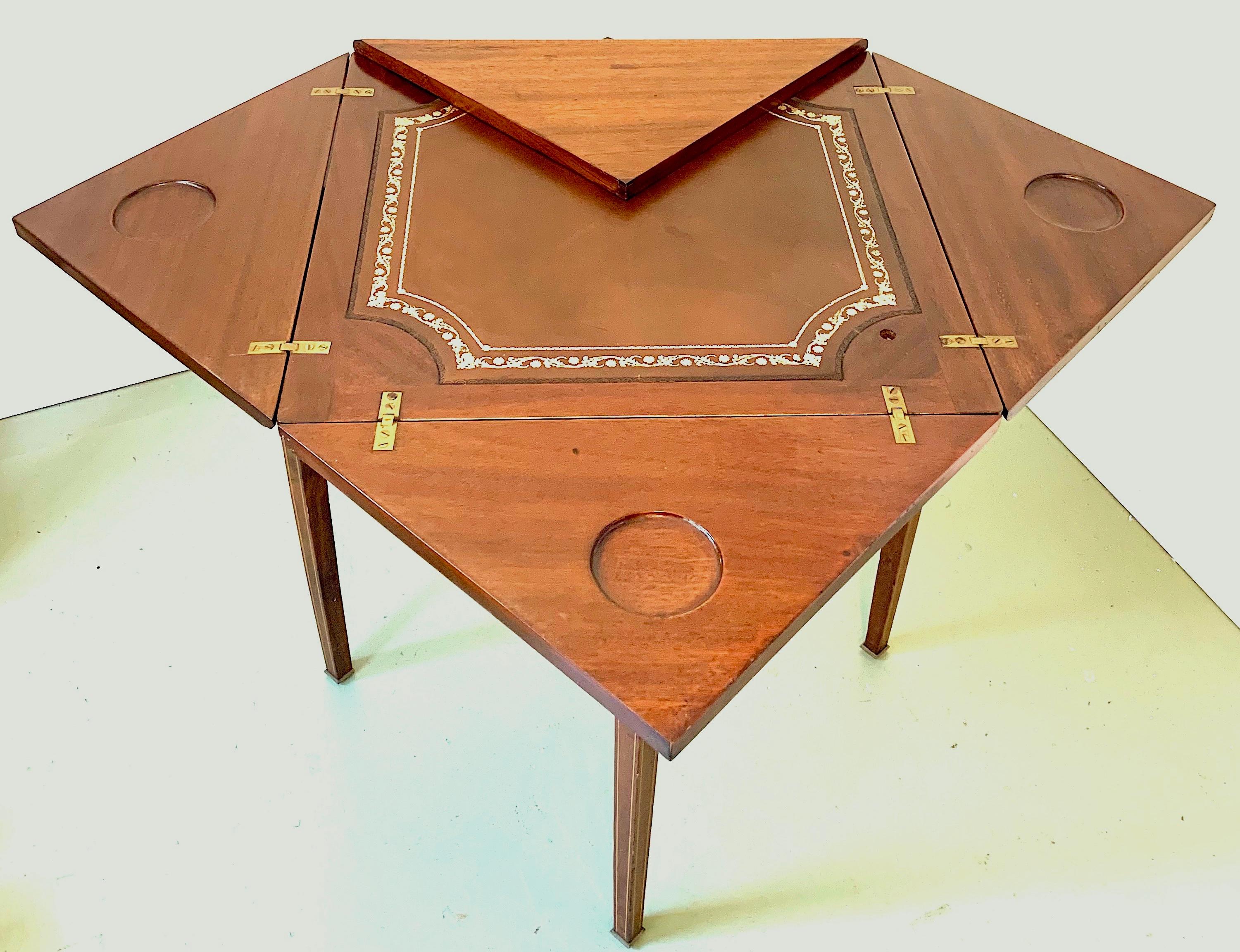 19th century wooden table with a beautiful envelope top. A turning action reveals the envelope diamond top to expose a leather game board insert with surrounding four insert compartments. This wonderful piece is ready for enjoyment.
Open top