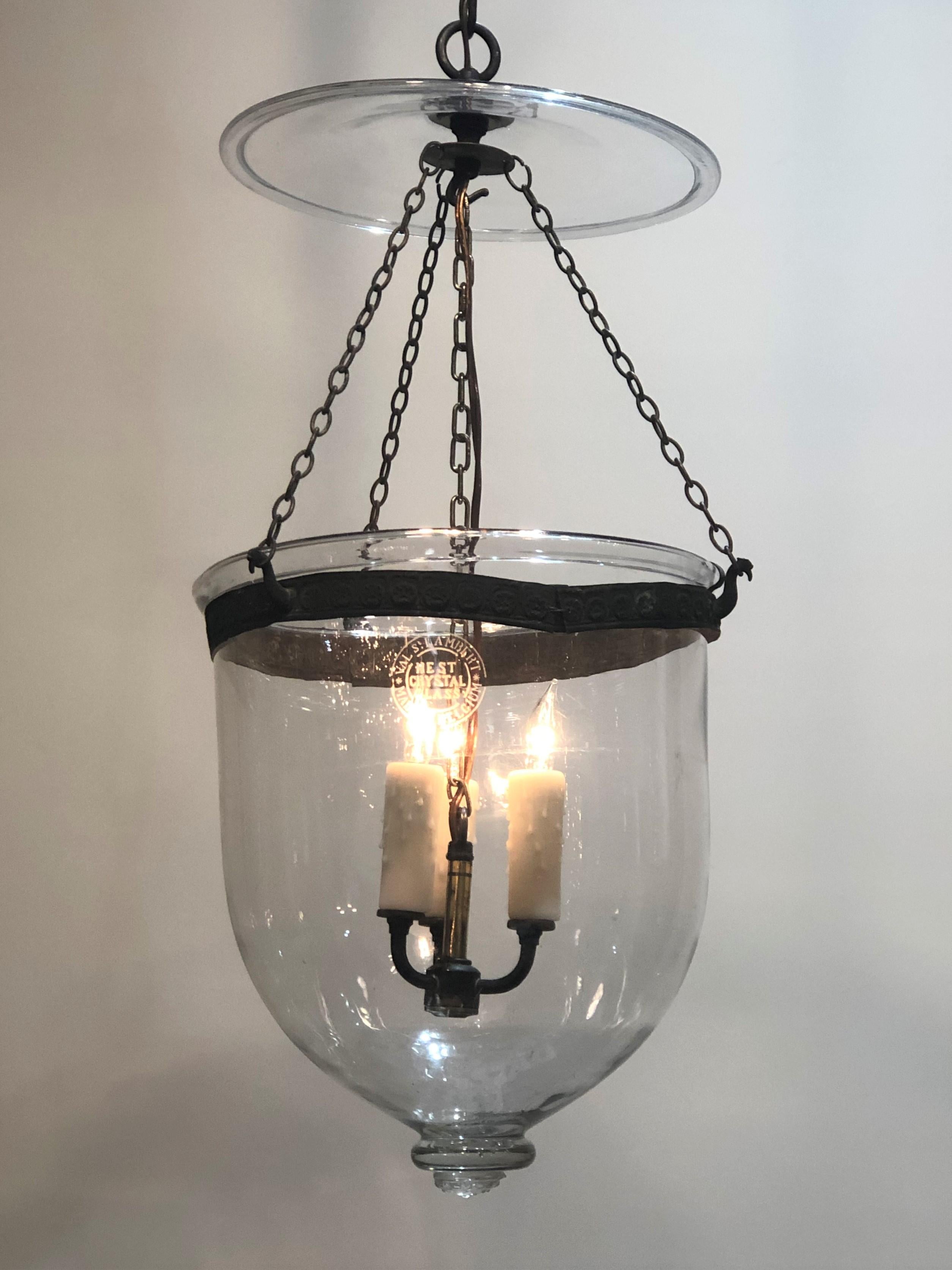 19th century Bell Jar lantern signed Val St. Lambert in the crystal Bell Jar. The Bell Jar is hanging by a pressed brass ring with three bird heads. The bird heads are suspended from three brass chains going up to a crystal smoke bell. The Bell Jar