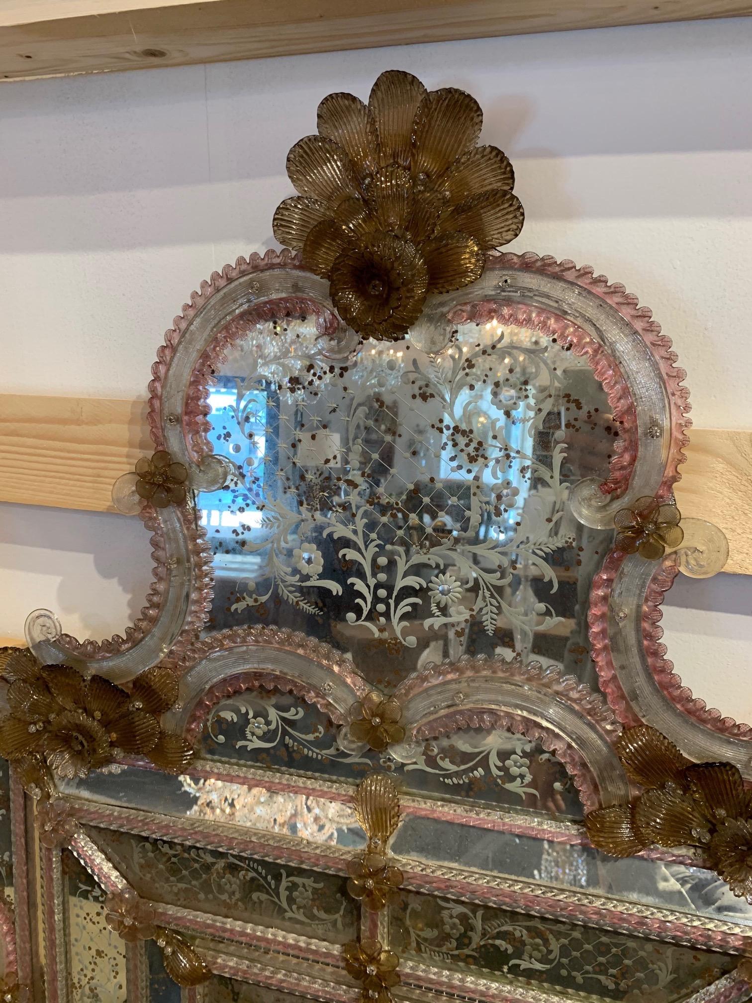 Outstanding 19th century Venetian etched glass mirror. Featuring gold and pale pink Venetian glass and a beautiful etched mirror featuring a floral pattern. The mirror is all original and complete. A real work of art!!