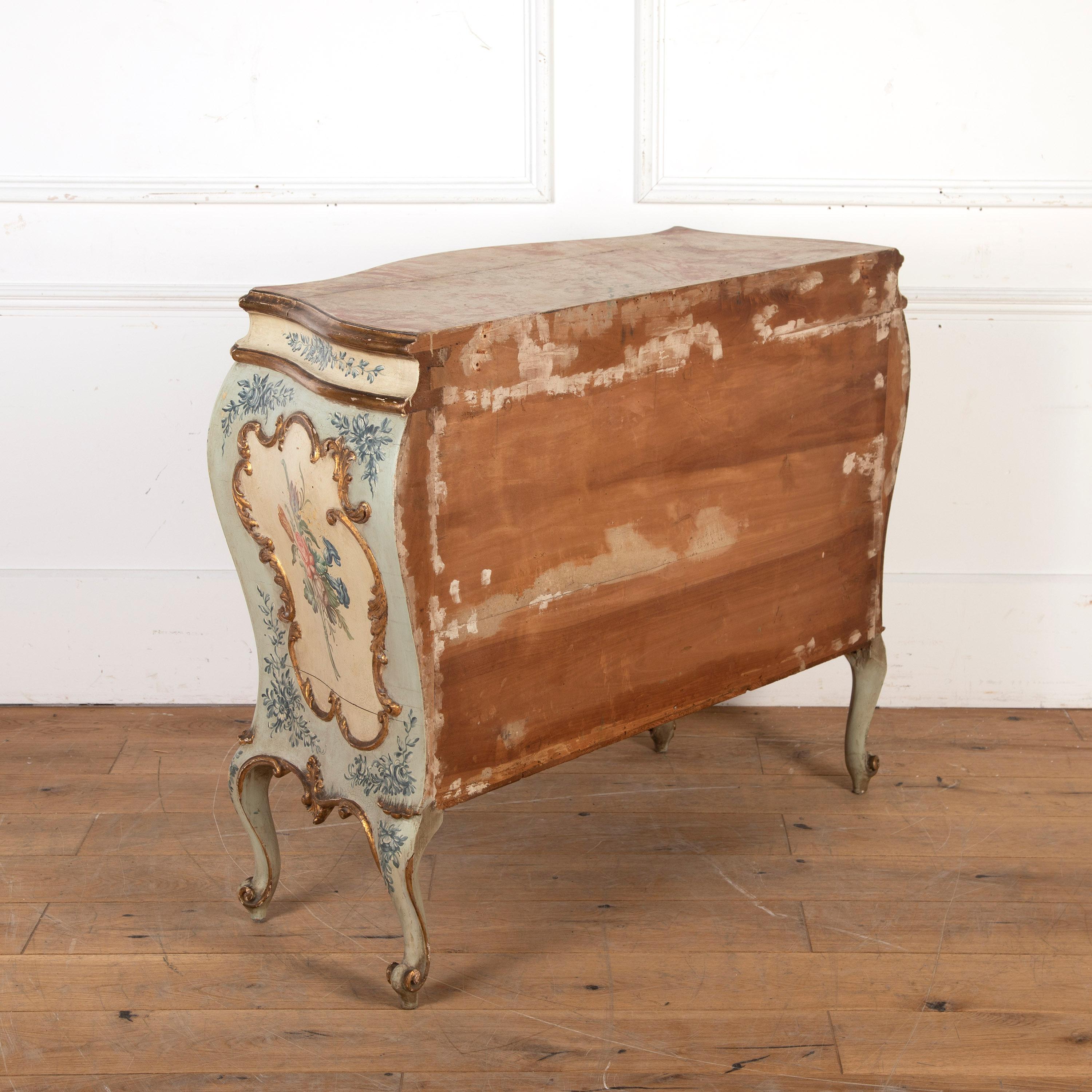 Beautiful early 19th Century Venetian hand-painted and gilt bombe commode.

Features two large drawers that open with their working keys. This commode is in its original and beautifully patinated finish.

The top is painted faux marble and has