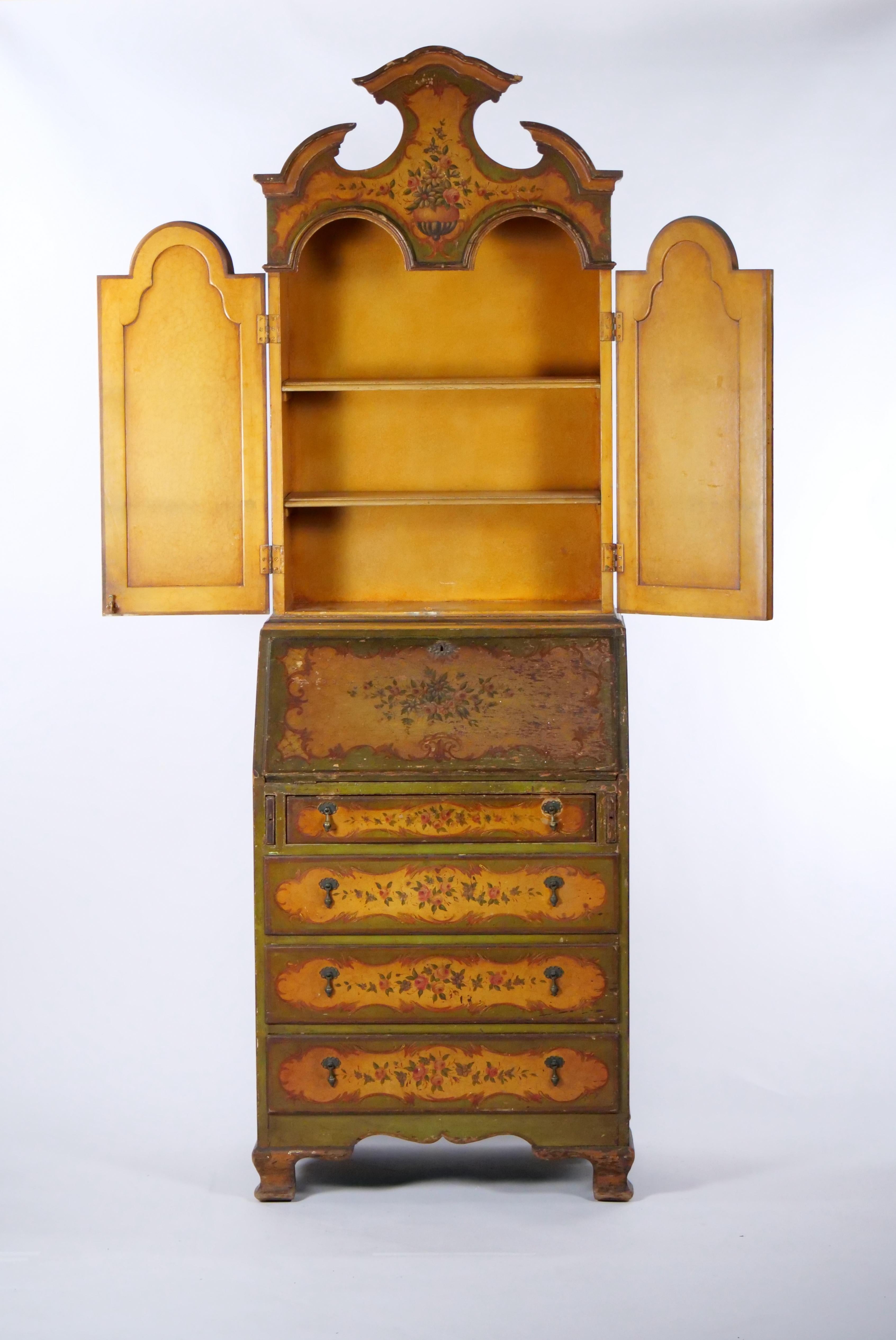 This is a Classic Venetian style Italian polychrome lacquered bookcase with hand painted floral decoration all over. This case piece is exquisitely hand painted with floral decoration and overall parcel gilt. The piece is very sturdy with lots of