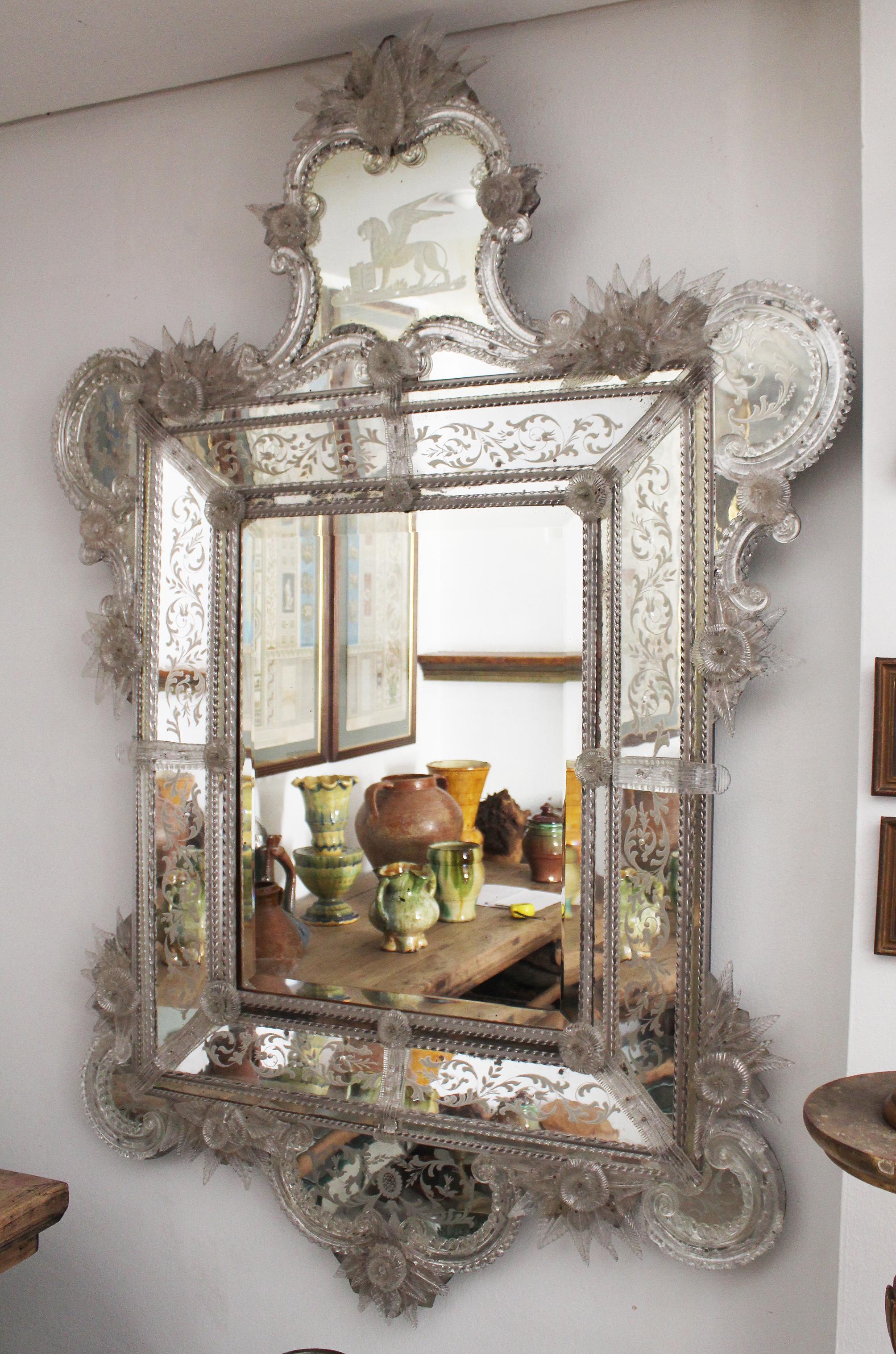 19th century Venetian mirror profusely decorated with floral motifs. Great quality mirror carvings and crystal pieces.
