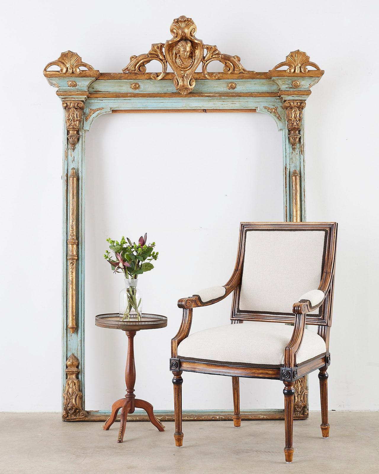 Opulent mid to late 19th century Venetian mirror frame or picture frame. Features a parcel gilt and sea foam green painted rectangular form. The grand gilt carved central mount includes acanthus scrolls with palmette and rocaille motifs. Centered by
