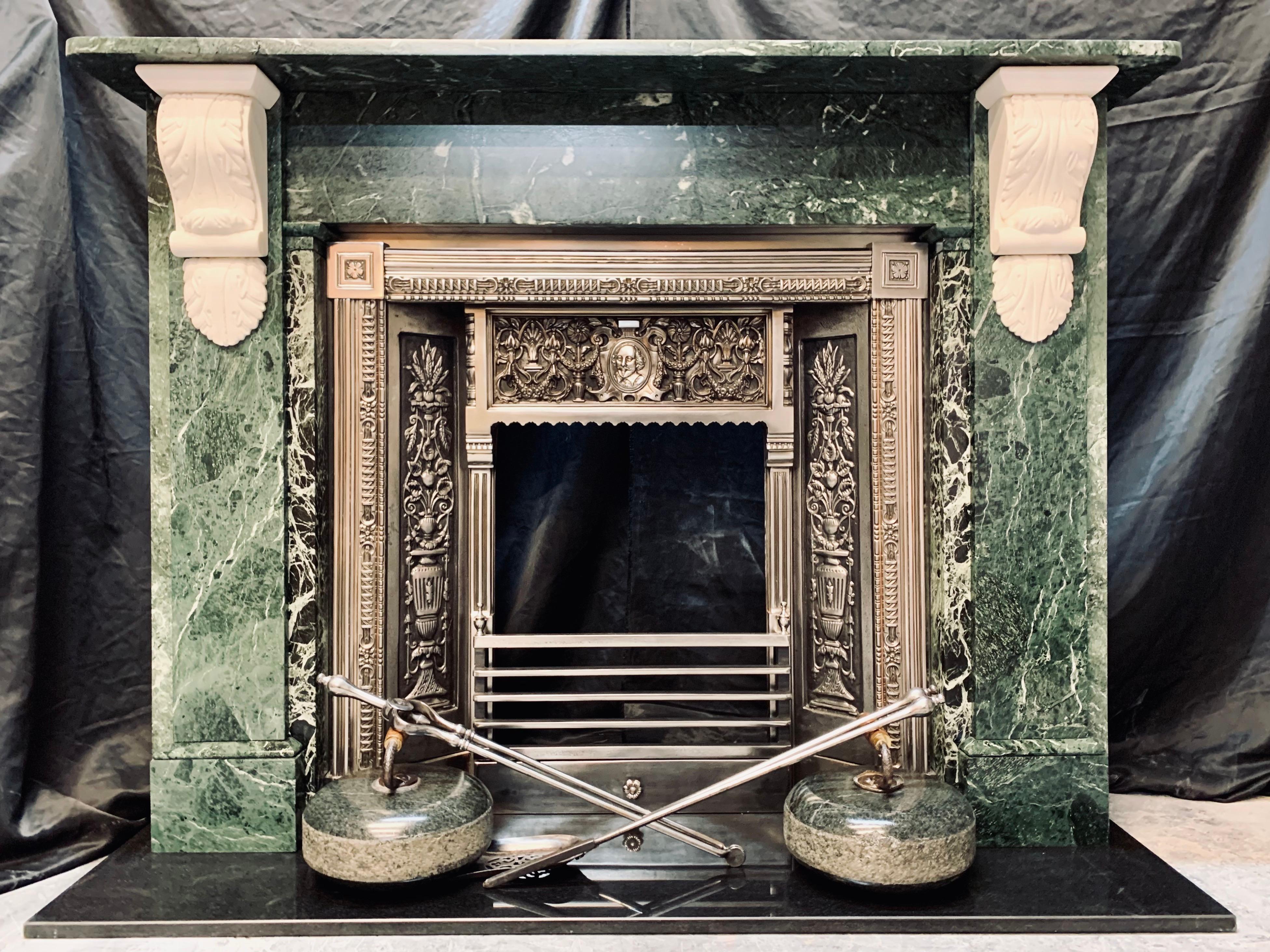 A pleasing and bold 19th century fireplace surround displaying a two tone combination of Verde Antico marble with Statuary marble corbels. A generous square edged shelf sits above an unadorned frieze, flanked by wide stepped jambs each surmounted