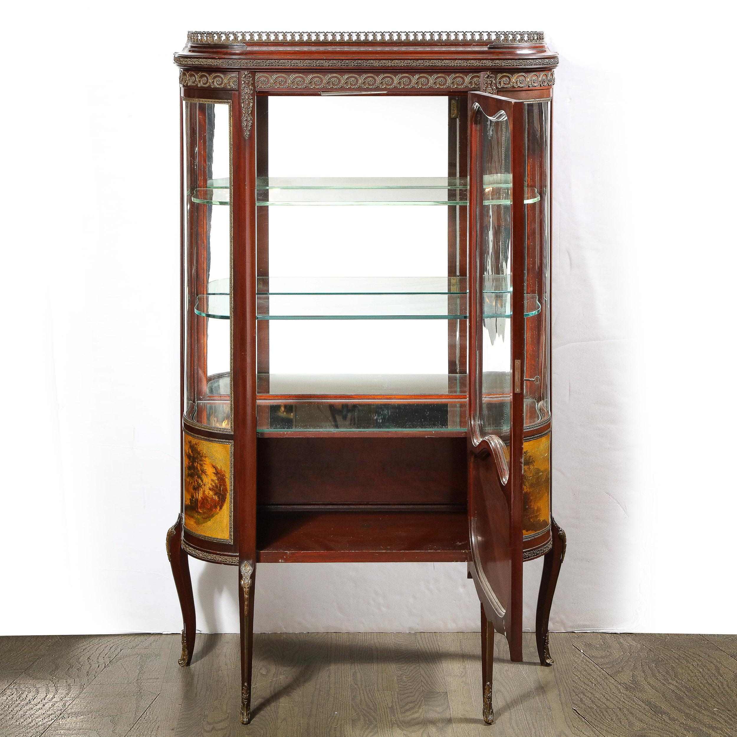 This stunning vitrine was realized by the esteemed maker Vernis Martin in France during the 19th century. The piece on stylized cabriolet legs that are traced down the center with a strip of bronze replete with a wealth of neoclassical detailing